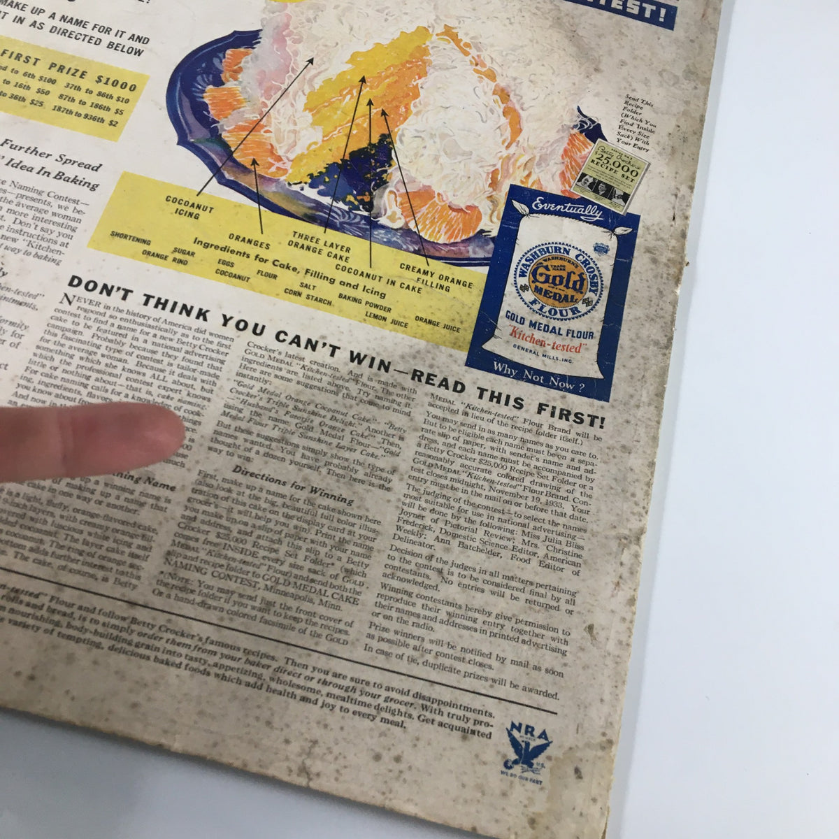 Close-up of the advertisement from the Vintage McCall's Magazine December 1933 Once Upon A Time by Frances N. Hart, highlighting the Betty Crocker Cake Naming Contest with details and colorful graphics.
