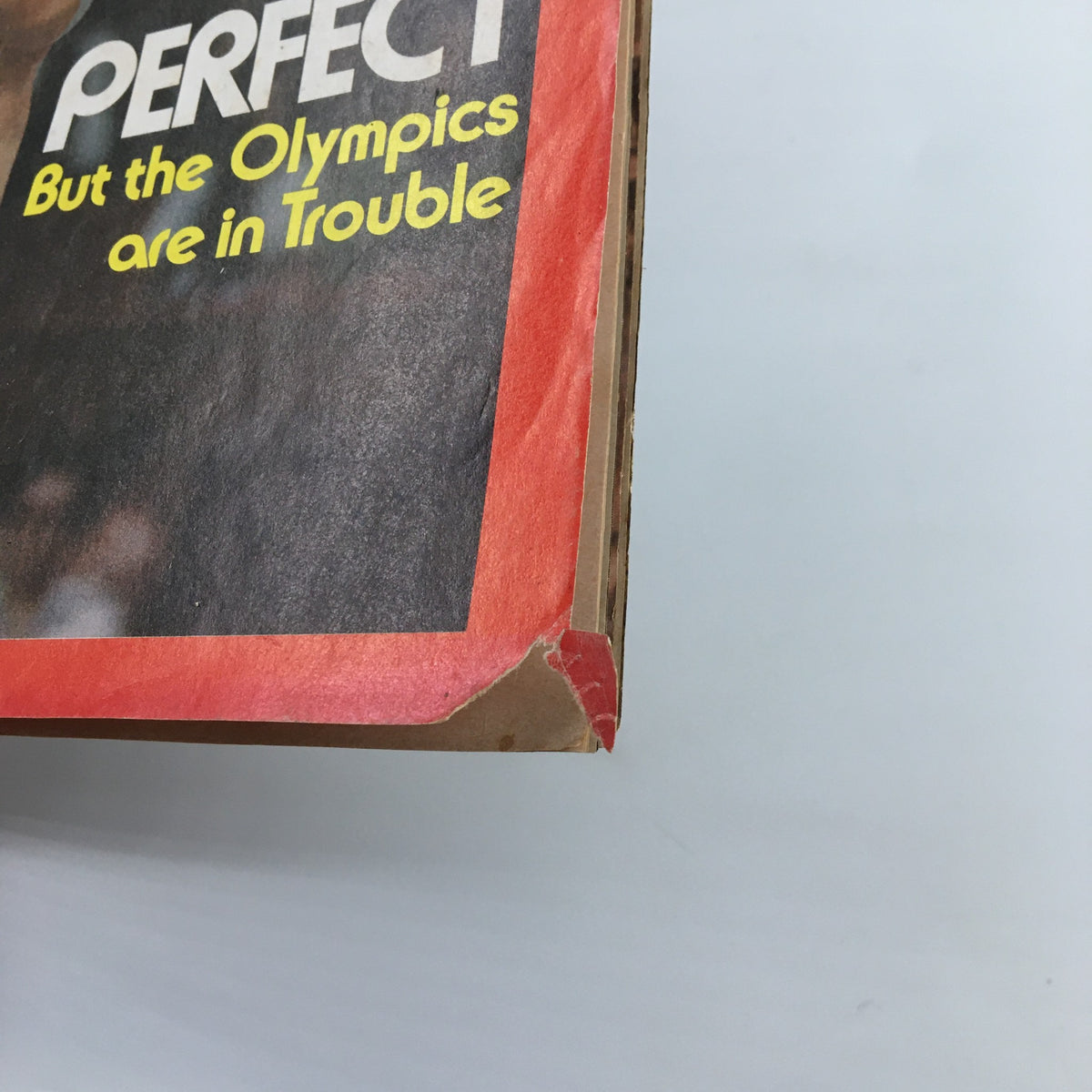 Side view of the vintage Time Magazine from August 2, 1976, displaying the condition and edge of the magazine cover featuring Nadia Comaneci.