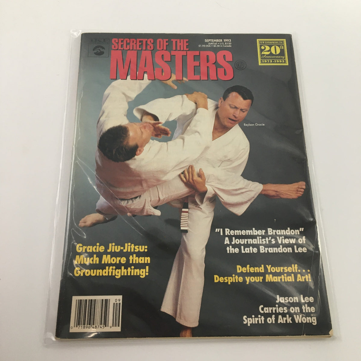 Secrets of the Masters September 2003 magazine cover featuring Reylson Gracie demonstrating a martial arts technique with another practitioner. Highlights include articles about Gracie Jiu-Jitsu and insights on Brandon Lee.