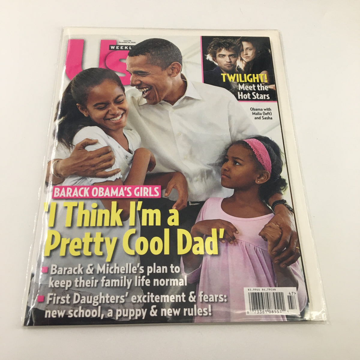 Front cover of US Weekly Magazine November 24, 2008 showcasing Barack Obama with his daughters under the headline 'I Think I'm a Pretty Cool Dad'. Highlights the family's approach to normalcy in the public eye.
