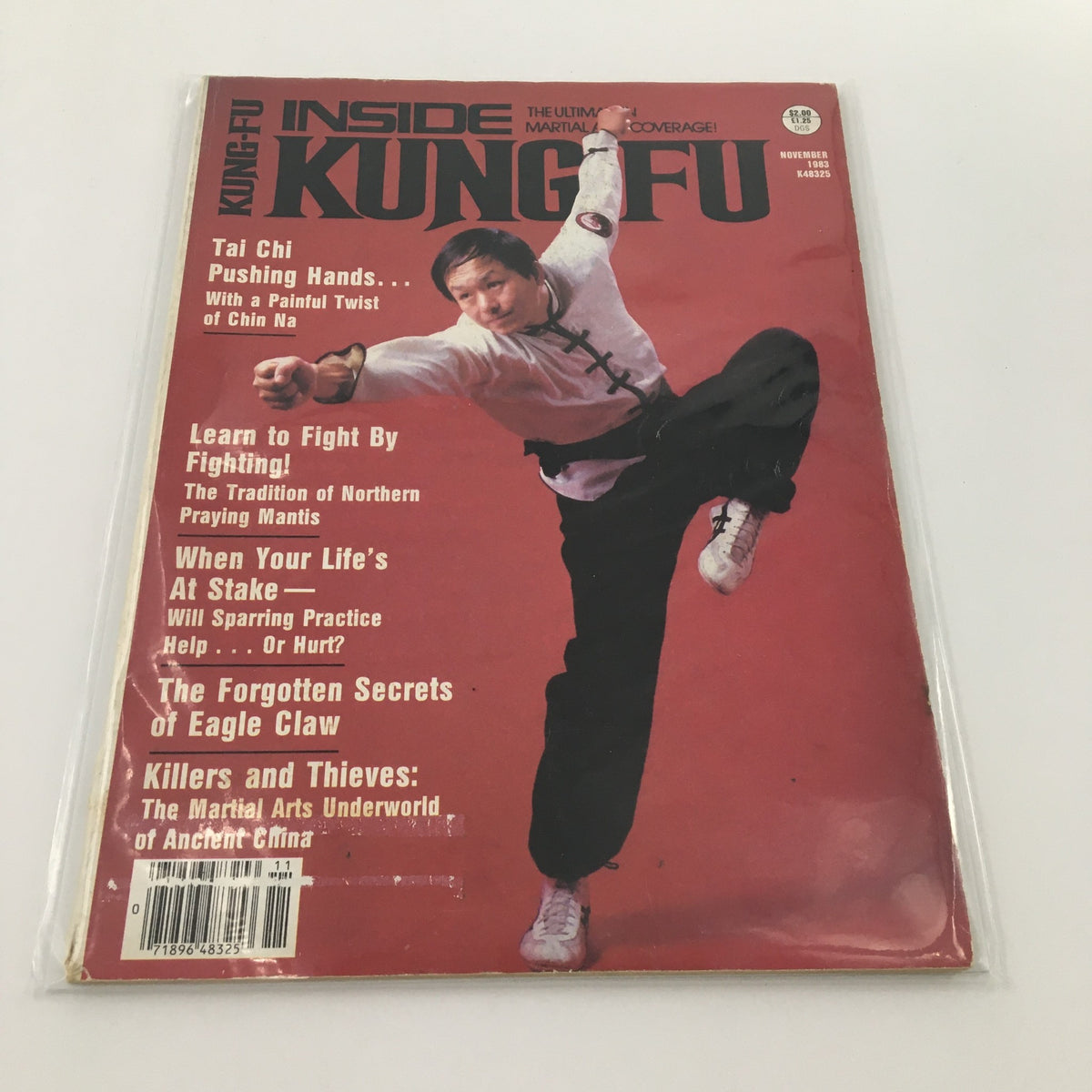 Cover of Inside Kung-Fu Magazine November 1983 featuring Tai Chi and the article on Painful Twist of Chin Na, showcasing martial arts techniques with a practitioner in action.