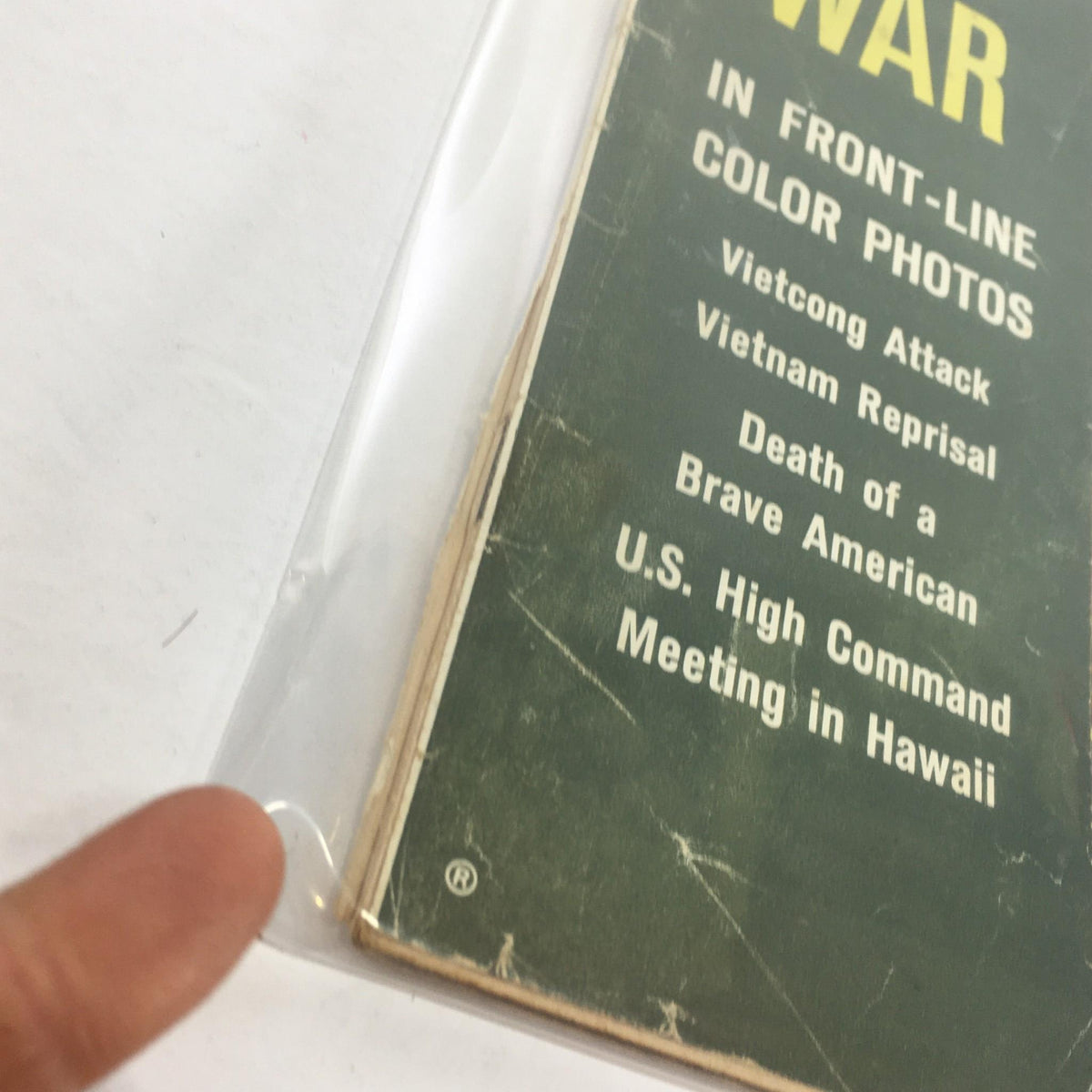 Close-up view of the edge of the VTG Life Magazine cover from June 12, 1964, which reads 'Vietnam Laos The Ugly War in Front-Line Color Photos'. The image details the textured condition and wear of the magazine.