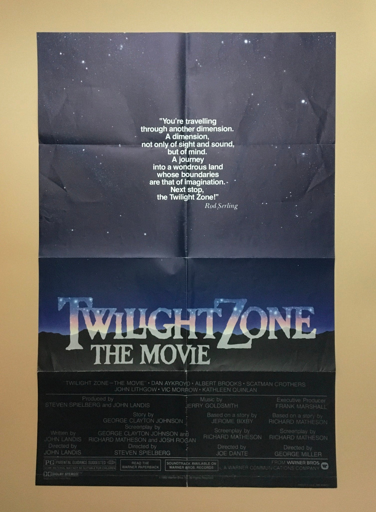 Original movie poster for '1983 Twilight Zone: The Movie' featuring a starry night background and quote by Rod Serling on dimension travel.