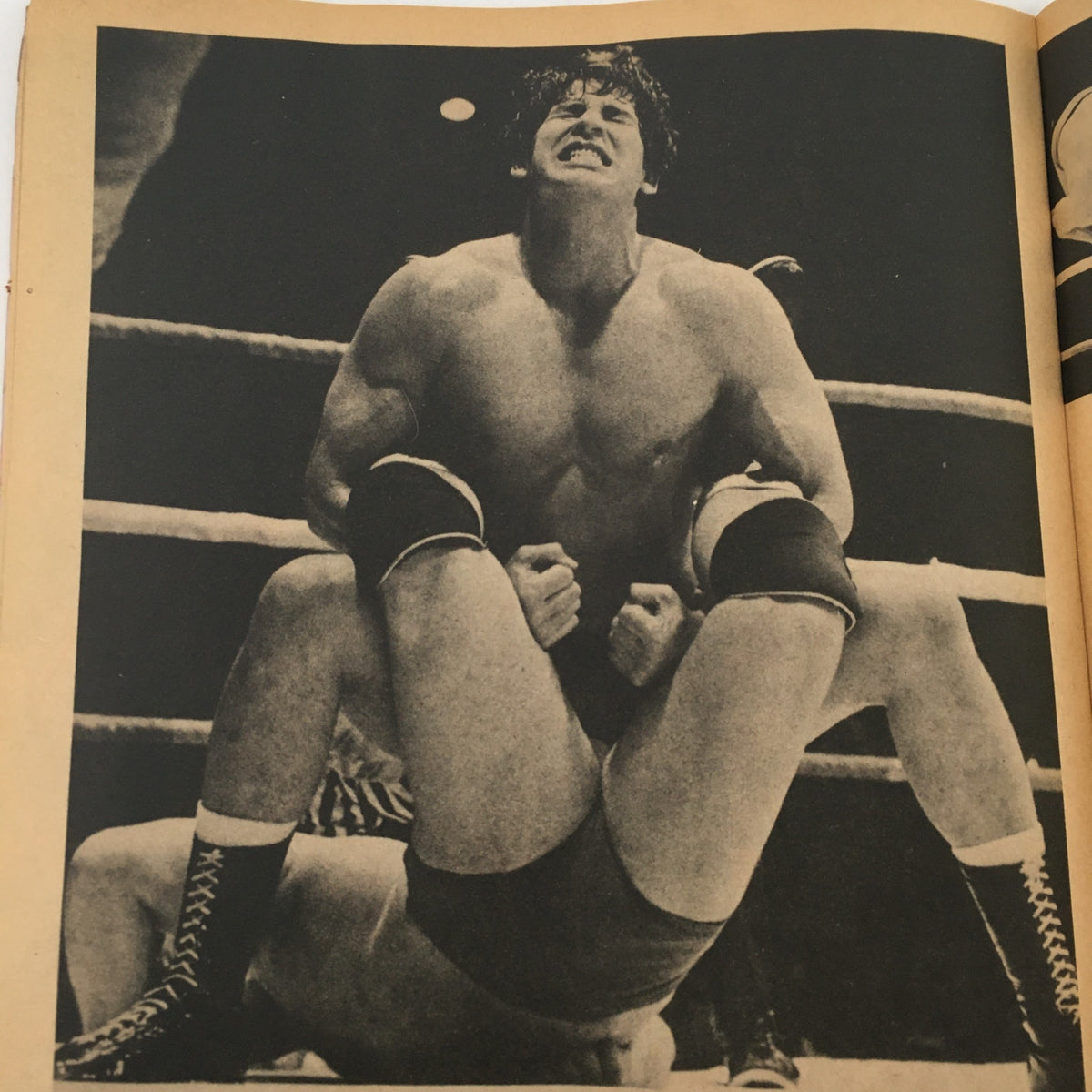Inside Wrestling Magazine November 1981 featuring a wrestling match action shot, showcasing a contestant in a muscular pose, demonstrating strength during a hold.