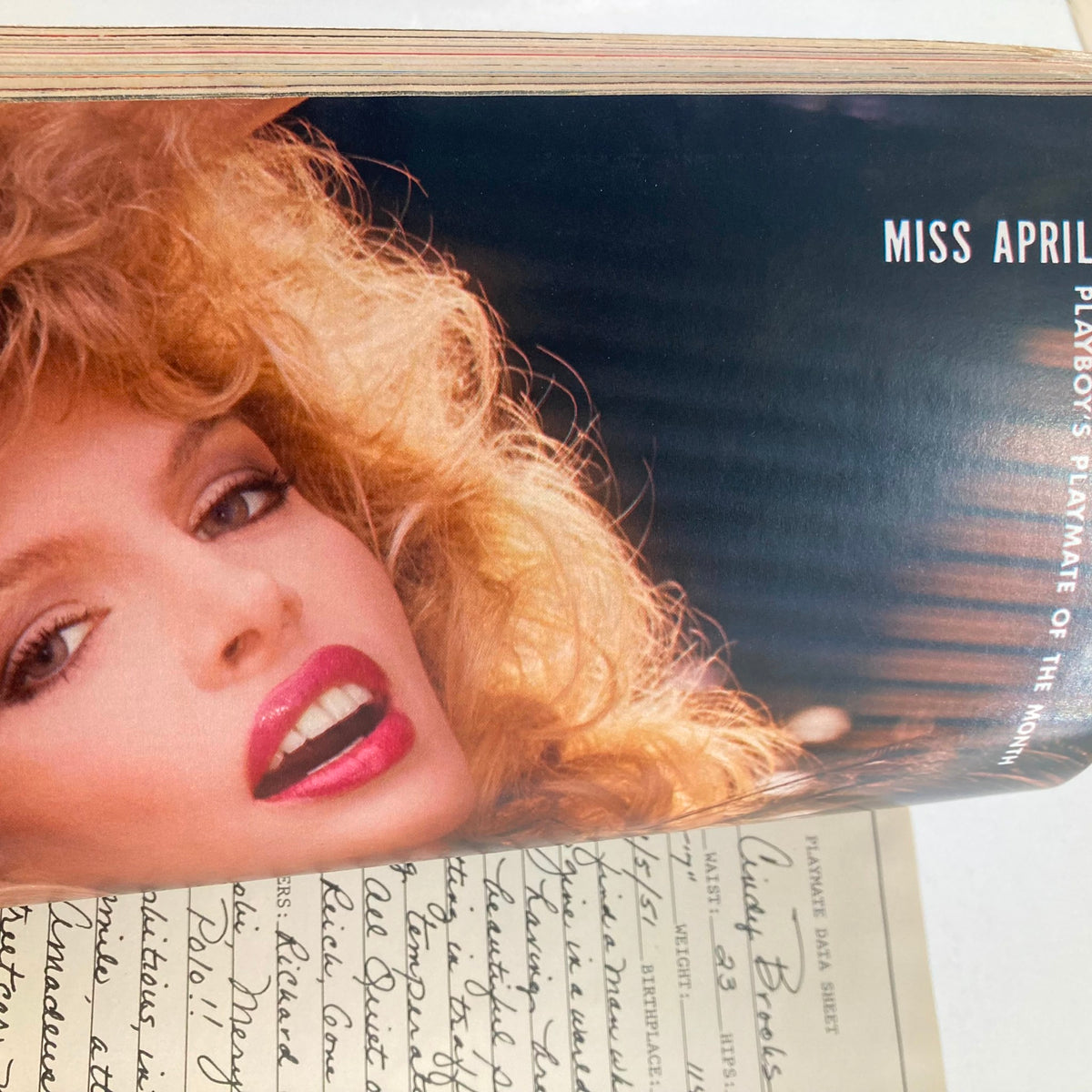 Inside page of VTG Playboy Magazine April 1985, displaying Miss April with glamorous hairstyle and makeup, highlighting the magazine's classic photography.