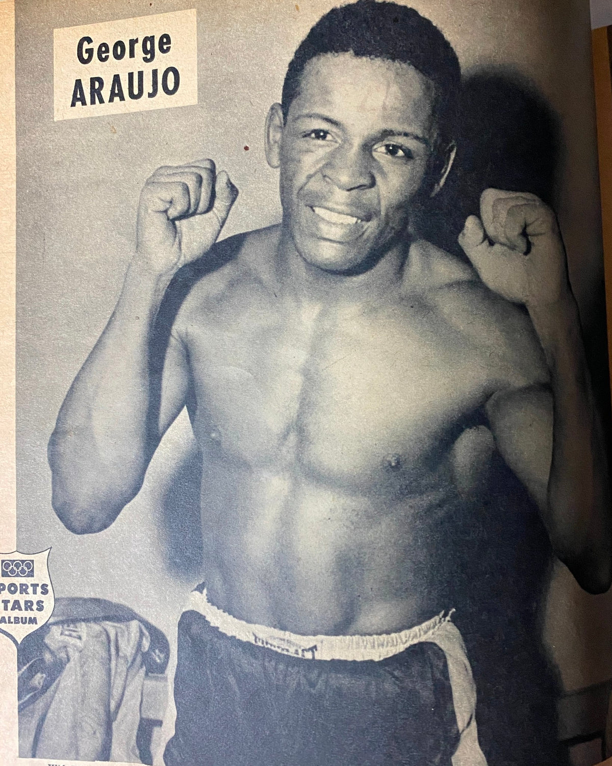 Sports Stars Magazine August 1952 featuring George Araujo, a boxer, showcasing his readiness in a posed photo with a confident expression.