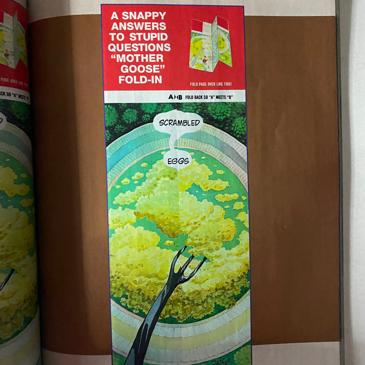 A humorous fold-in illustration from Mad Magazine 2023 Golden Collection of Garbage Special Collector's Edition, depicting a whimsical take on scrambled eggs with a playful design.