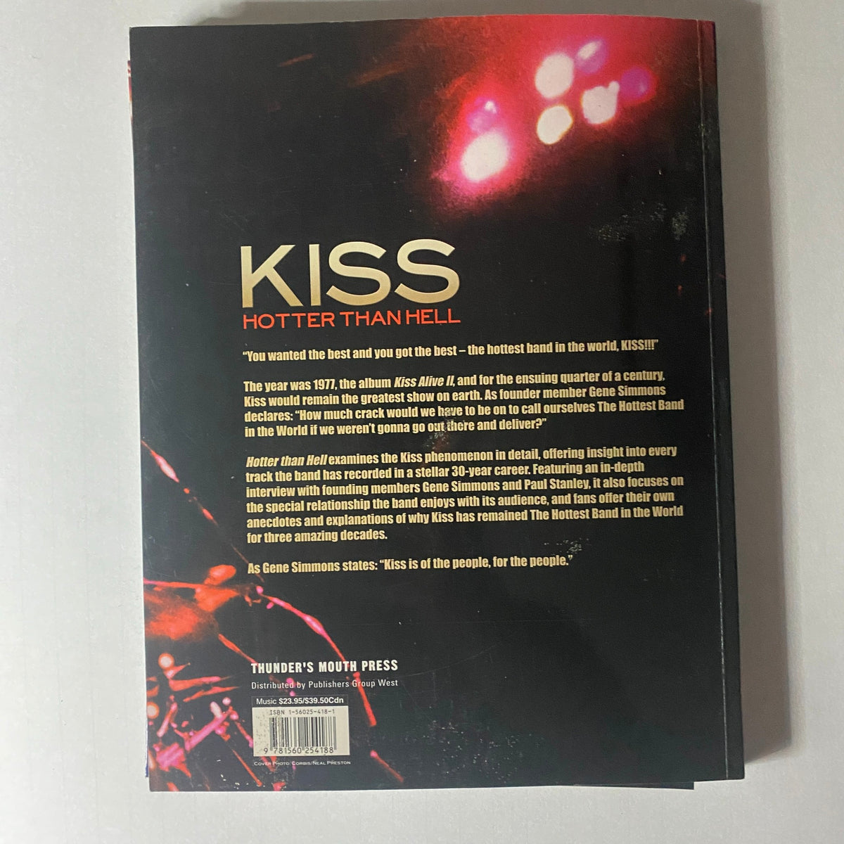 Back cover of the 2002 KISS: Hotter Than Hell: Stories Behind Every Song magazine by Paul Elliott, featuring a brief description of the magazine and its exploration of KISS's impact on rock music.