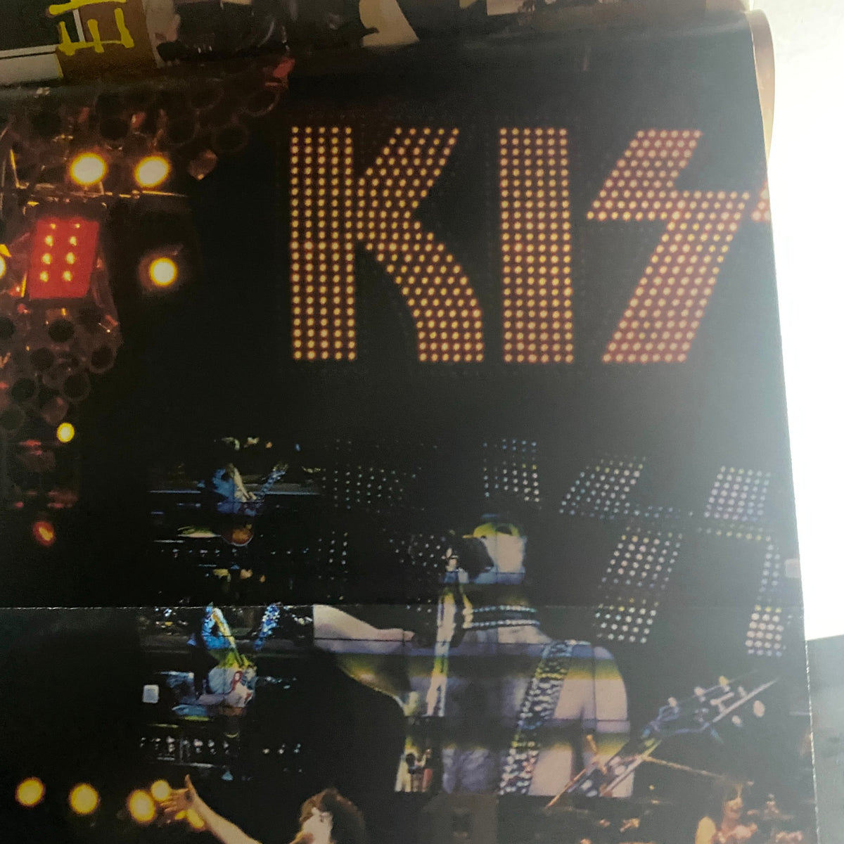 Dynamic live performance image from the Metal Edge Spring 1997 KISS Reunion Tour Magazine, highlighting the KISS logo and band members on stage.