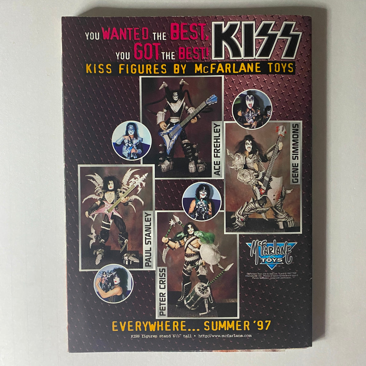 Promotional page for KISS collectible action figures by McFarlane Toys, featured in the Metal Edge Spring 1997 KISS Reunion Tour Magazine.