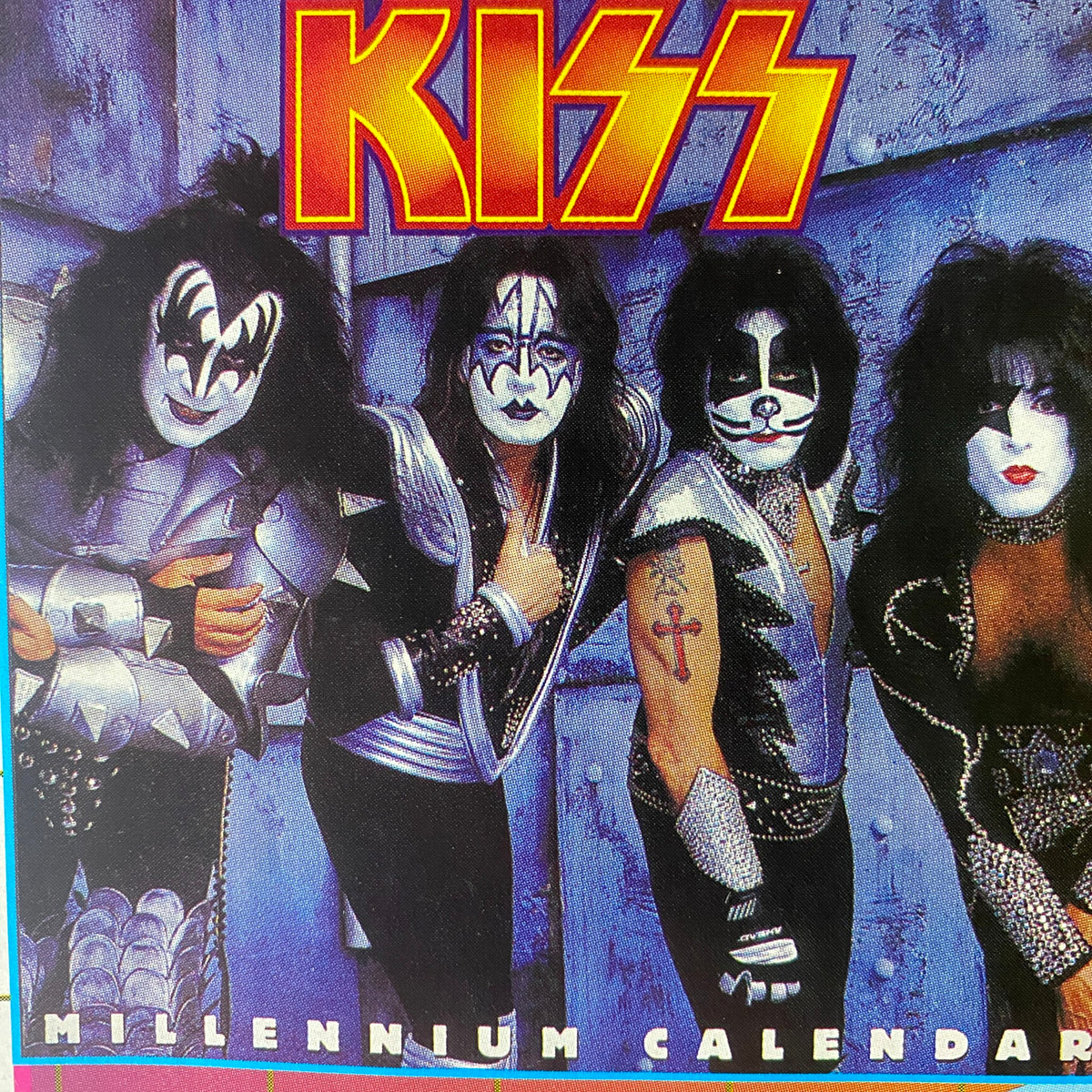 KISS band members in their iconic stage costumes on the cover of Metal Edge Magazine Summer 1999. The image prominently features the KISS logo and conveys the vibrant rock culture of the late 90s.