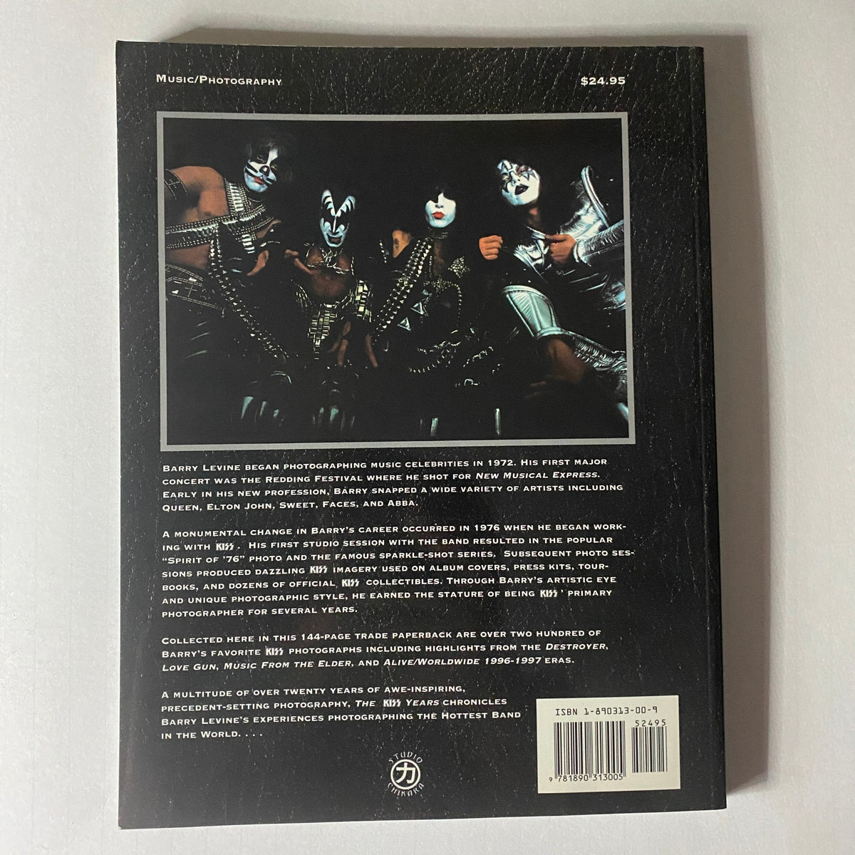 Back cover of '1997 The Kiss Years' by Barry Levine, showcasing KISS band members in iconic makeup and costumes, featuring details about the magazine's content and Barry Levine's photography career.