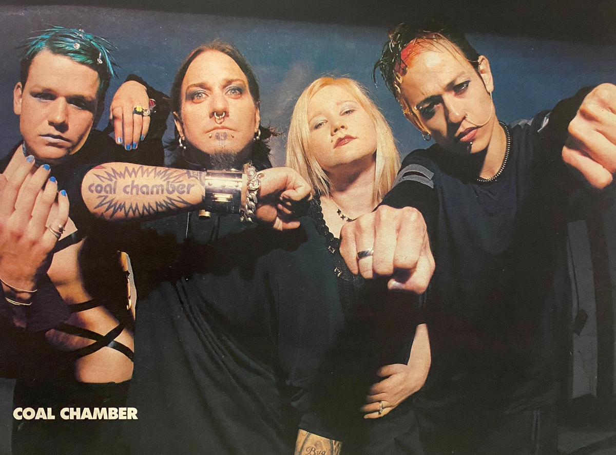 Coal Chamber band members posed for a photo in Metal Edge Magazine 2000, showcasing their unique style and essence of the early 2000s metal scene.