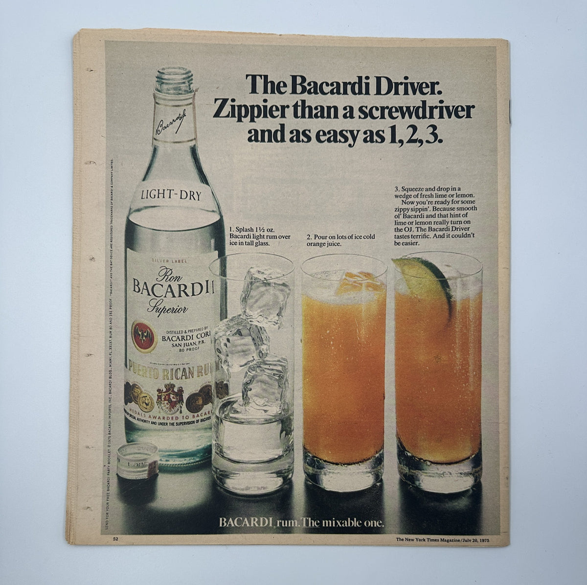 The New York Times Magazine July 20, 1975 advertisement for Bacardi, highlighting the 'Bacardi Driver' cocktail with a bottle of Bacardi rum and drinks, illustrating a vibrant and appealing beverage recipe.