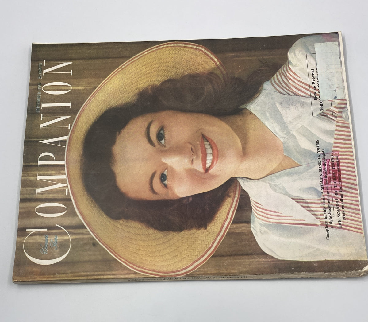 Woman's Home Companion Magazine September 1950 cover featuring a smiling woman in a wide-brimmed hat, showcasing vintage fashion and beauty of the 1950s.