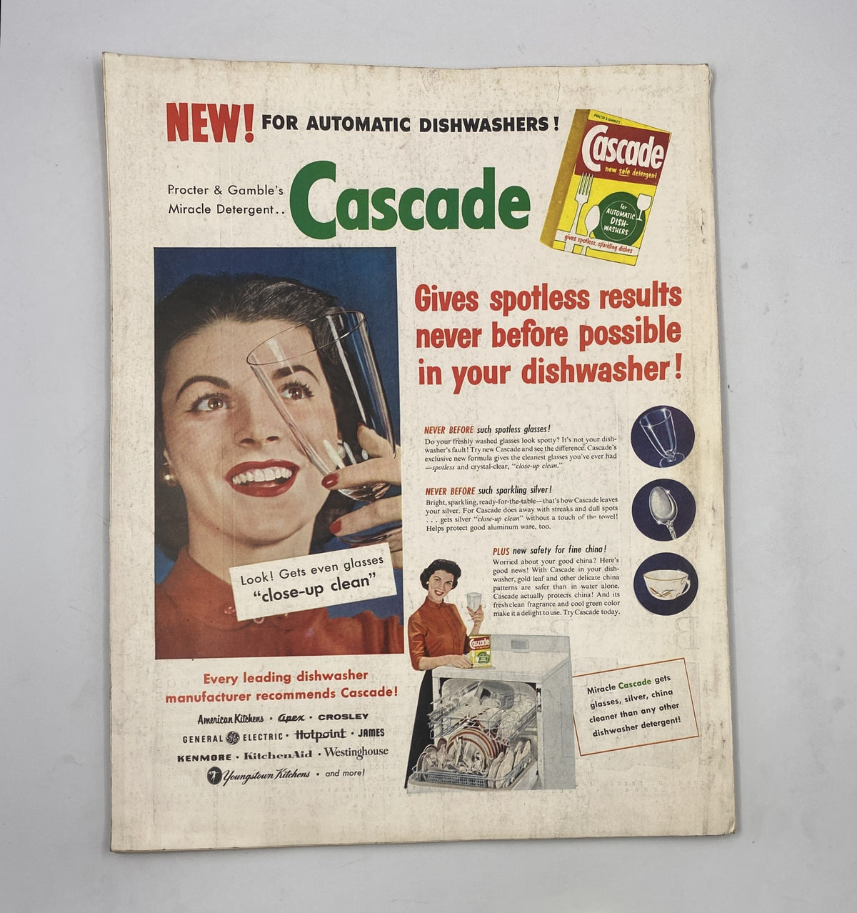 An advertisement for Cascade dishwasher detergent from Procter & Gamble, featured in the Woman’s Home Companion Magazine February 1956. The ad showcases the product's ability to give spotless results and includes a promotional image of a woman demonstrating the detergent's effectiveness on glassware.