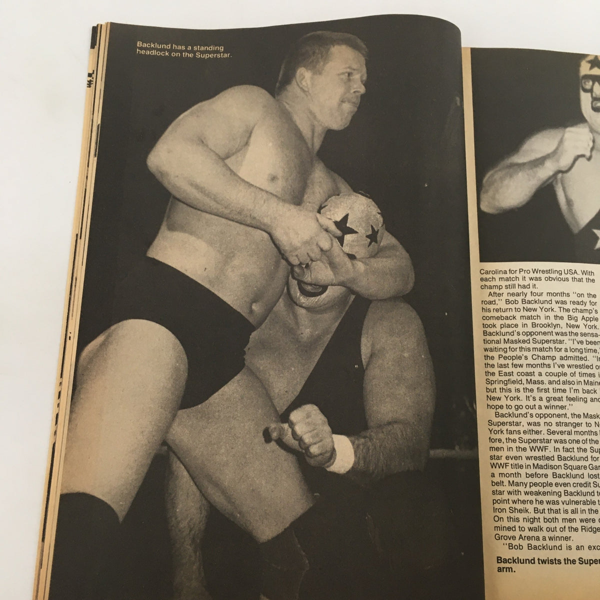 Wrestling Scene Magazine #22 May 1985 highlights wrestler Bob Backlund performing a standing headlock on his opponent, capturing the competitive spirit and physicality of wrestling in the ring.