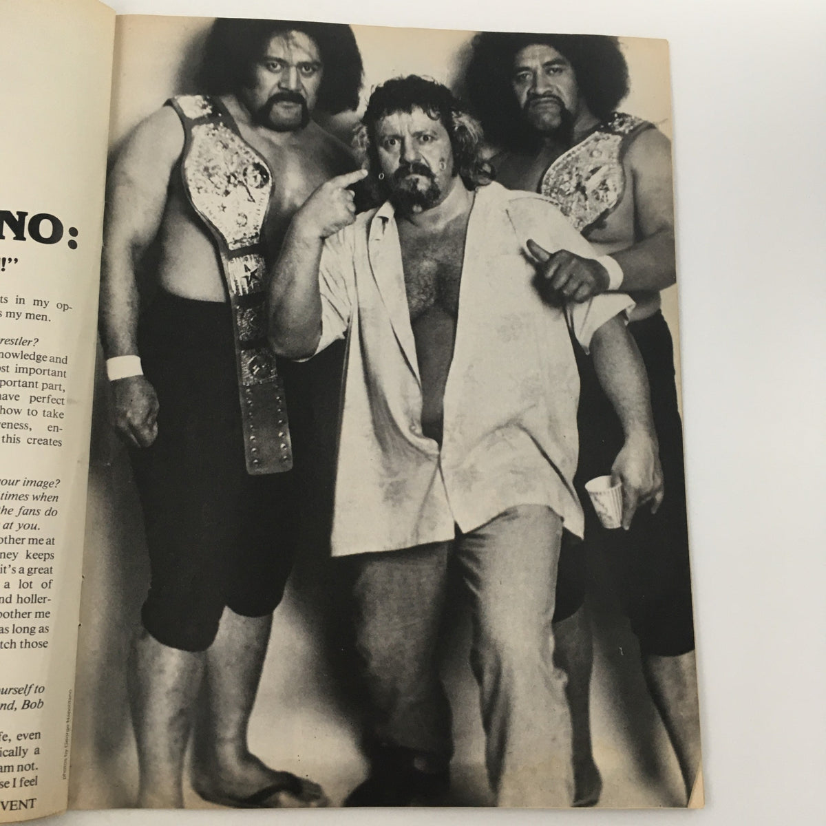 Inside spread of Wrestling's Main Event Magazine June 1982 featuring a black and white photo of wrestling figures, capturing the legendary presence in wrestling.