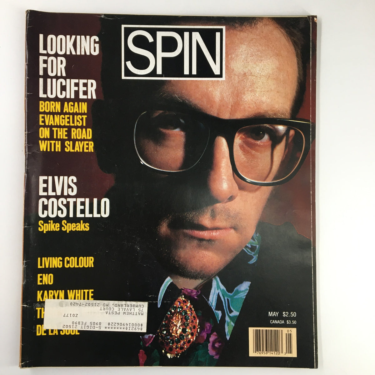 Cover of VTG Spin Magazine May 1989 Vol 5 #2 featuring Elvis Costello with the caption 'Looking for Lucifer' and highlights including 'Spike Speaks' and Karyn White.