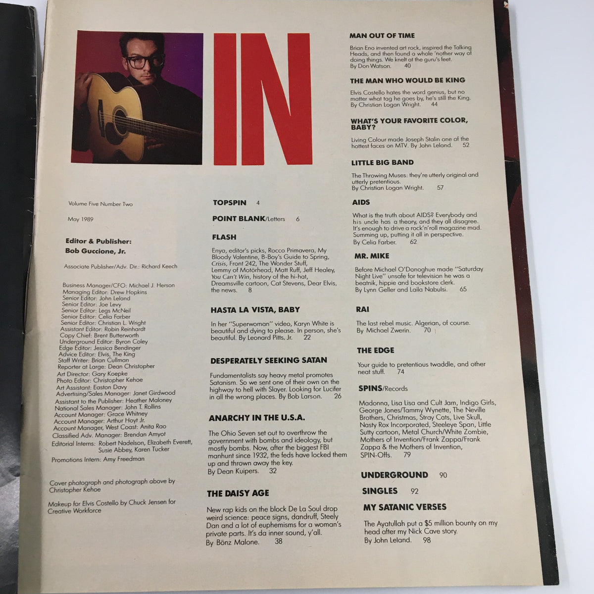 Interior page of VTG Spin Magazine May 1989 Vol 5 #2 showing an article list and an image of Elvis Costello with an acoustic guitar.