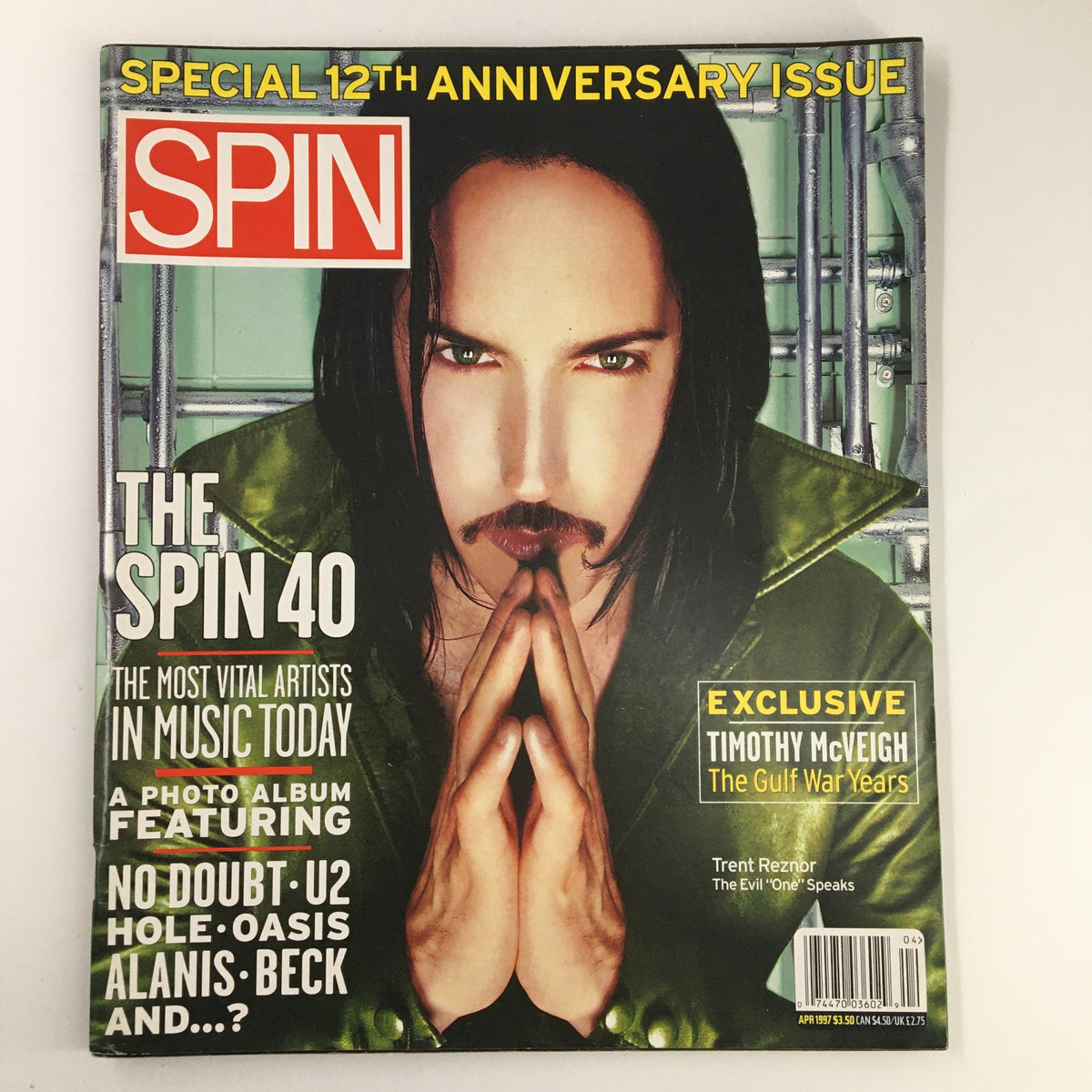 Cover of Spin Magazine April 1997 Vol 13 #1 featuring Trent Reznor in a striking pose. This special edition includes an exclusive interview titled 'The Evil One Speaks'.