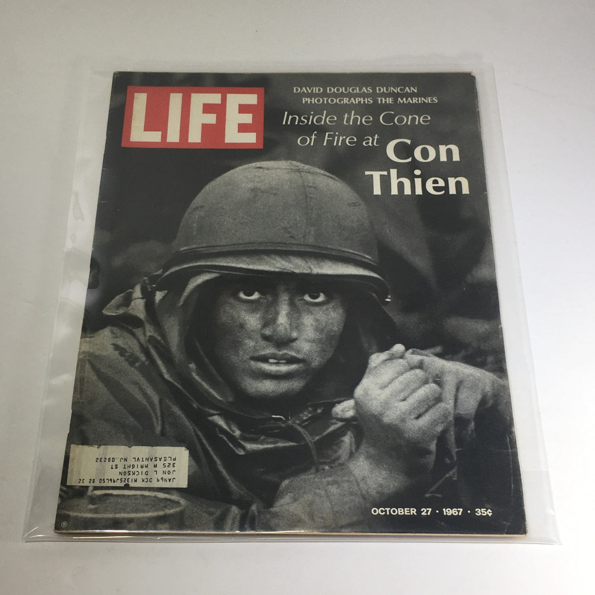 Cover of VTG Life Magazine: October 27 1967 featuring a photograph by David Douglas Duncan of a Marine during the Vietnam War, showcasing the intense emotions of combat.