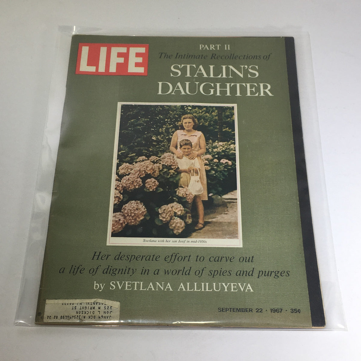 Life Magazine cover from September 22, 1967, featuring Part II: Intimate Photo of Stalin's Daughter, depicting Svetlana Alliluyeva with her son amidst vibrant flowers, highlighting the historical and cultural context of the Cold War era.