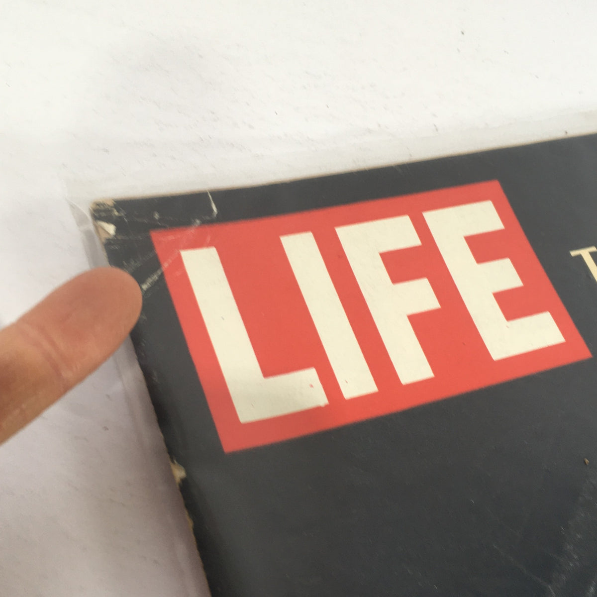 Top edge of Life Magazine January 6 1967, showing the recognizable 'LIFE' logo and minor wear, reflecting its vintage status.