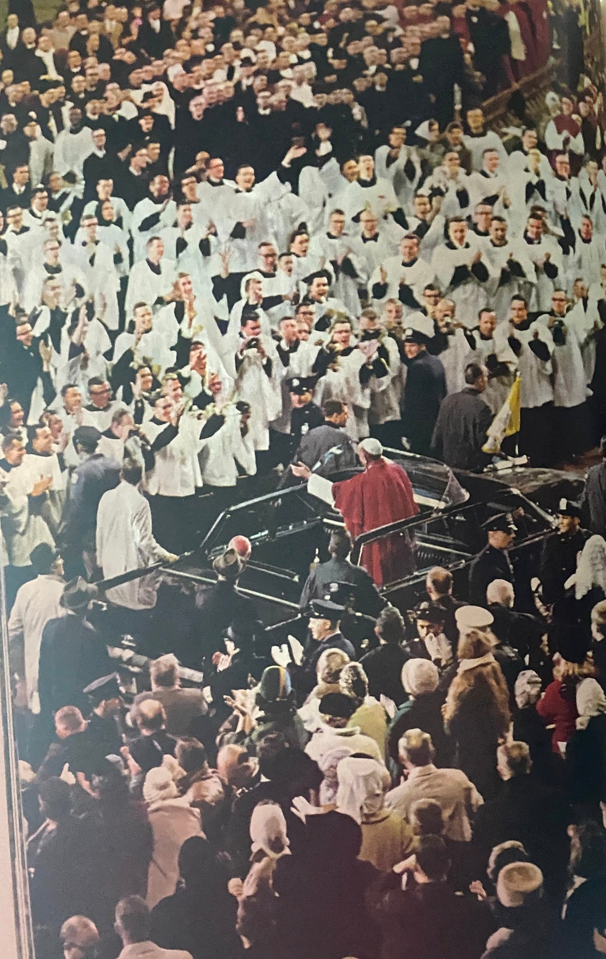 1965 Time Life Special Report: The Pope's Visit - A crowd of clergy and laypeople cheering as Pope Paul VI arrives, illustrating the excitement of his historical visit.