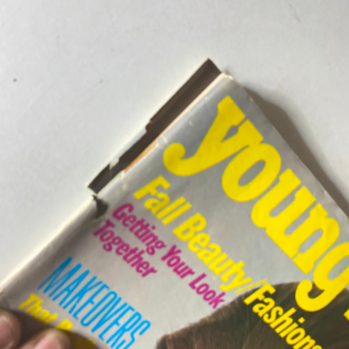Close-up view of the Young Miss Magazine August 1981 cover focusing on the title and headlines about beauty and fashion tips for young women.