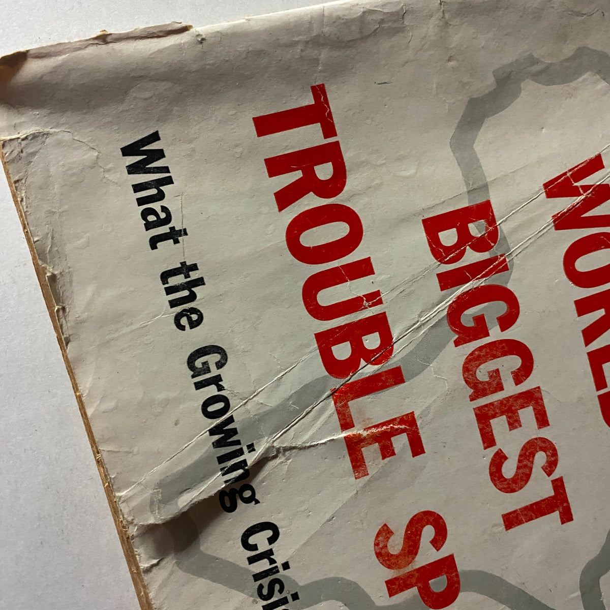 Close-up of the cover of U.S. News & World Report Magazine, April 25, 1960, highlighting the phrase 'World's Biggest Trouble Spot' and additional insights on African crises.