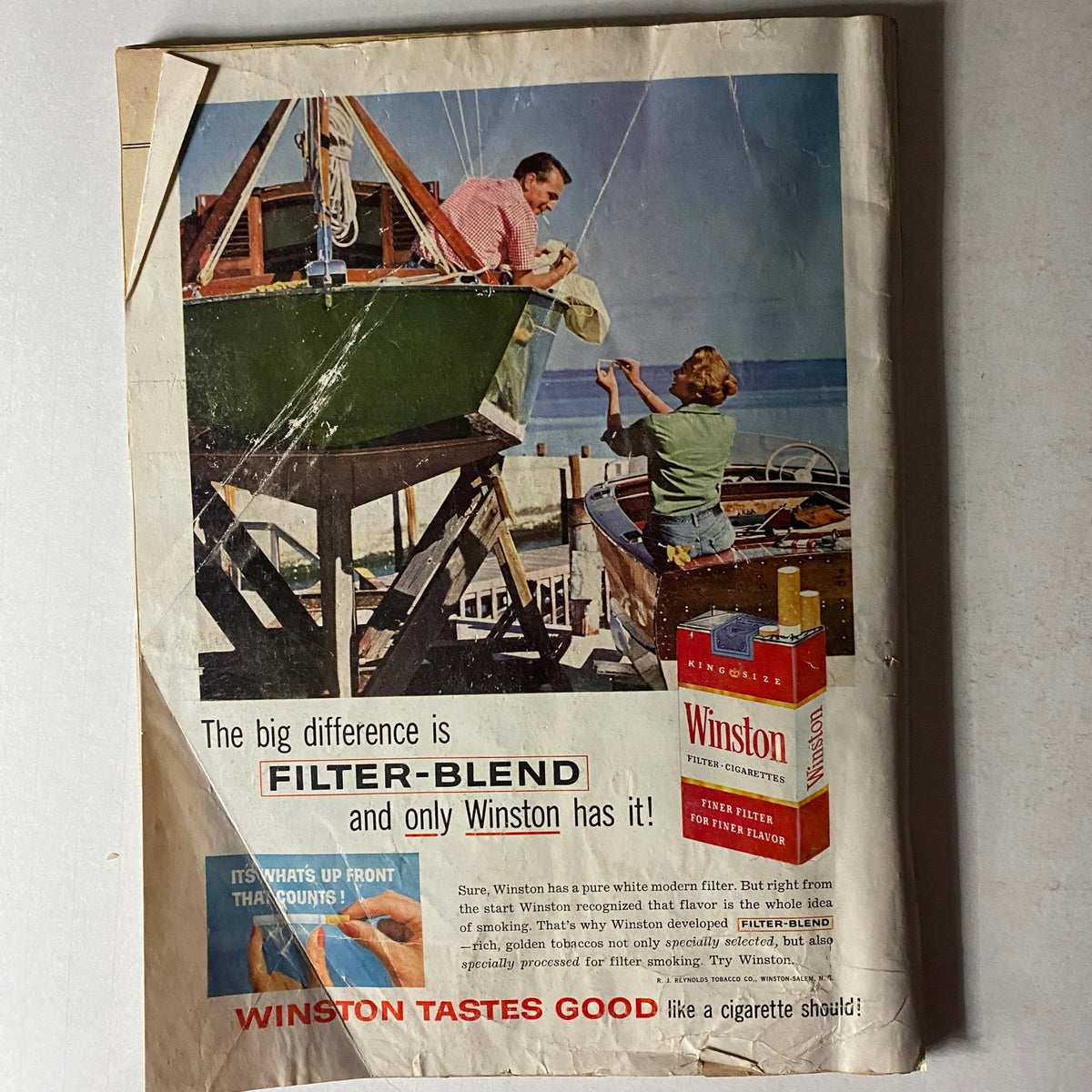 Advertisment page from U.S. News & World Report Magazine April 25, 1960 promoting Winston cigarettes, emphasizing the unique features of their filter-blend.
