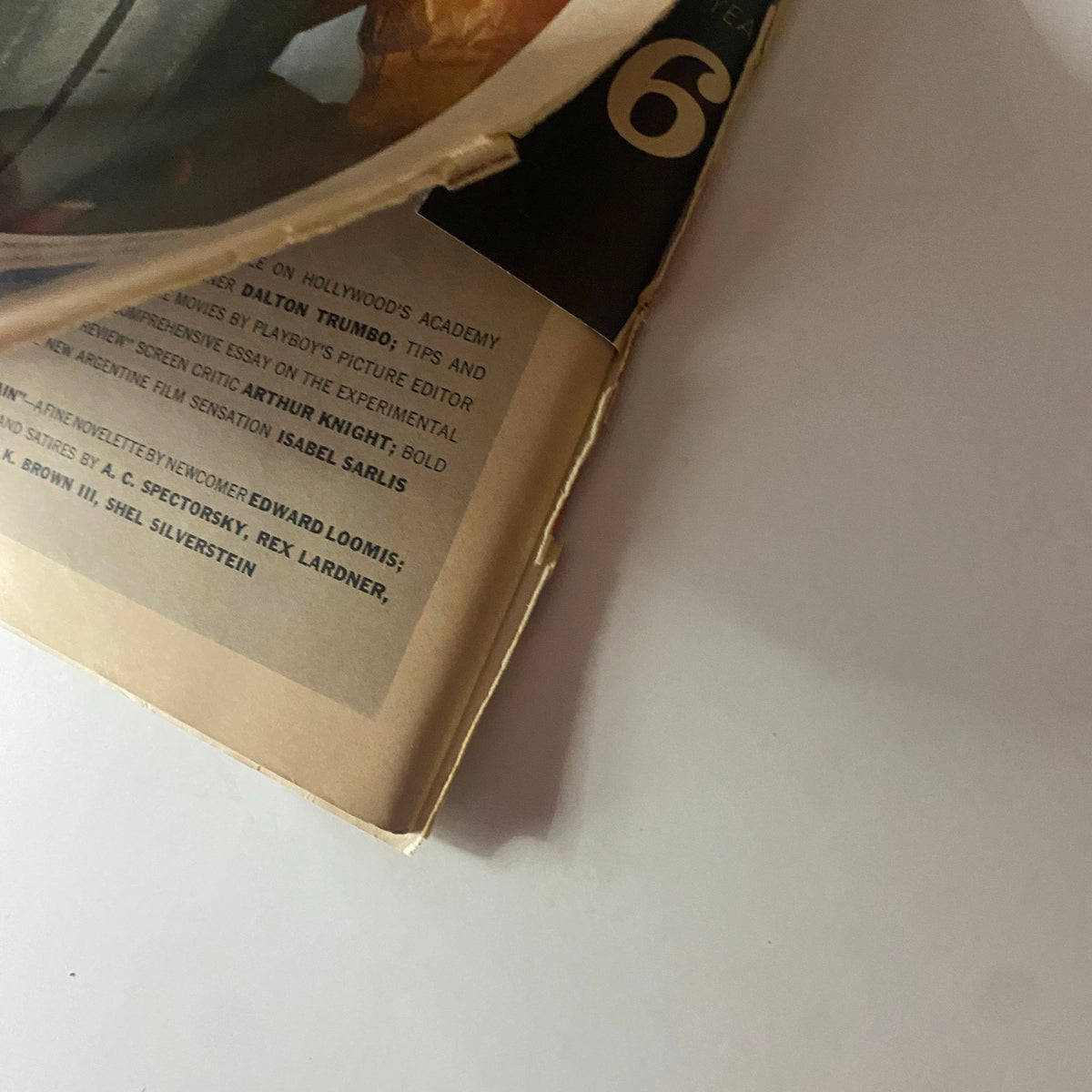 Close-up view of the spine and cover corner of Playboy Magazine March 1960, featuring Sally Sarell as centerfold, highlighting its vintage condition and historical significance.