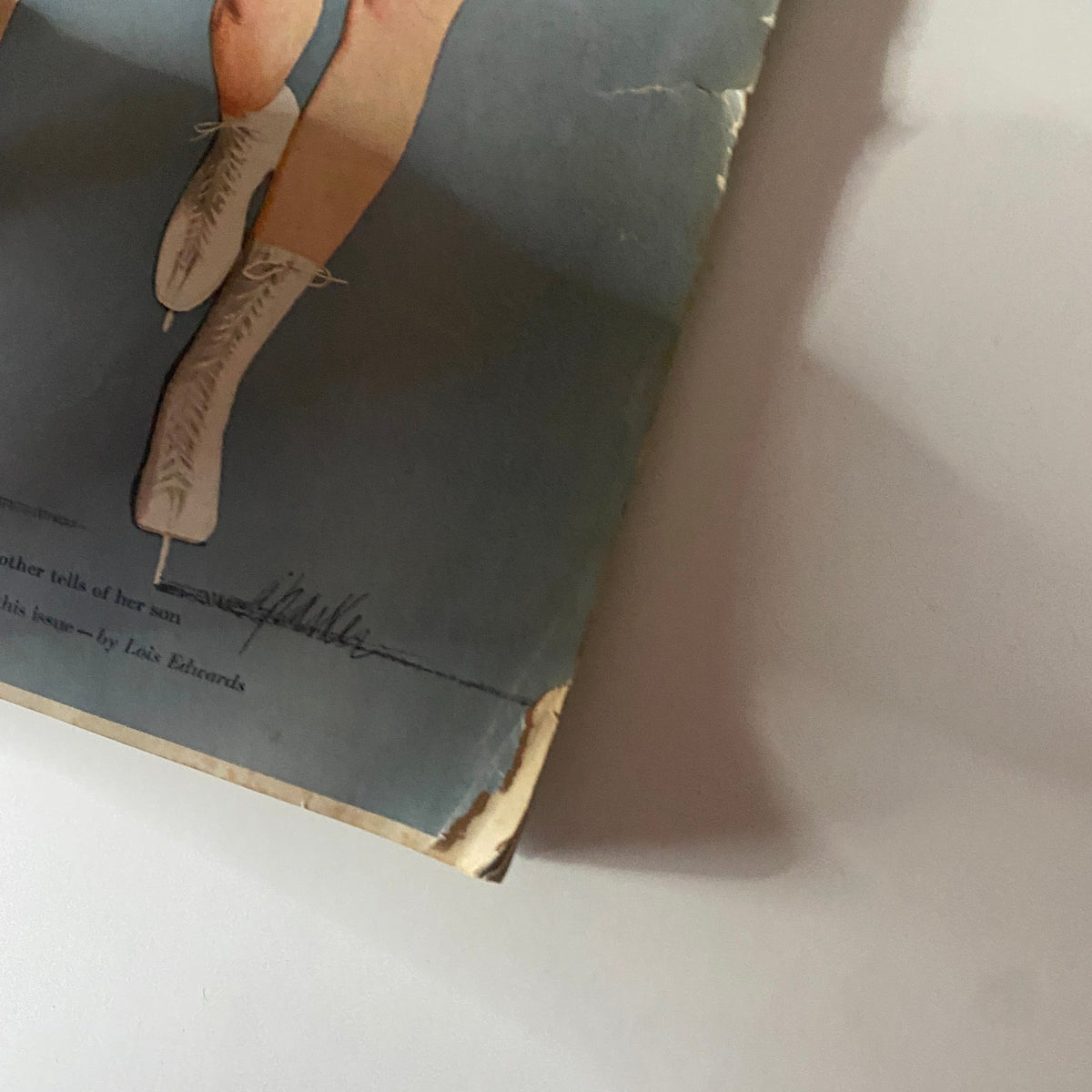 Close-up of the bottom section of the cover from Ladies' Home Journal Magazine February 1951 highlighting women's stylish winter boots.