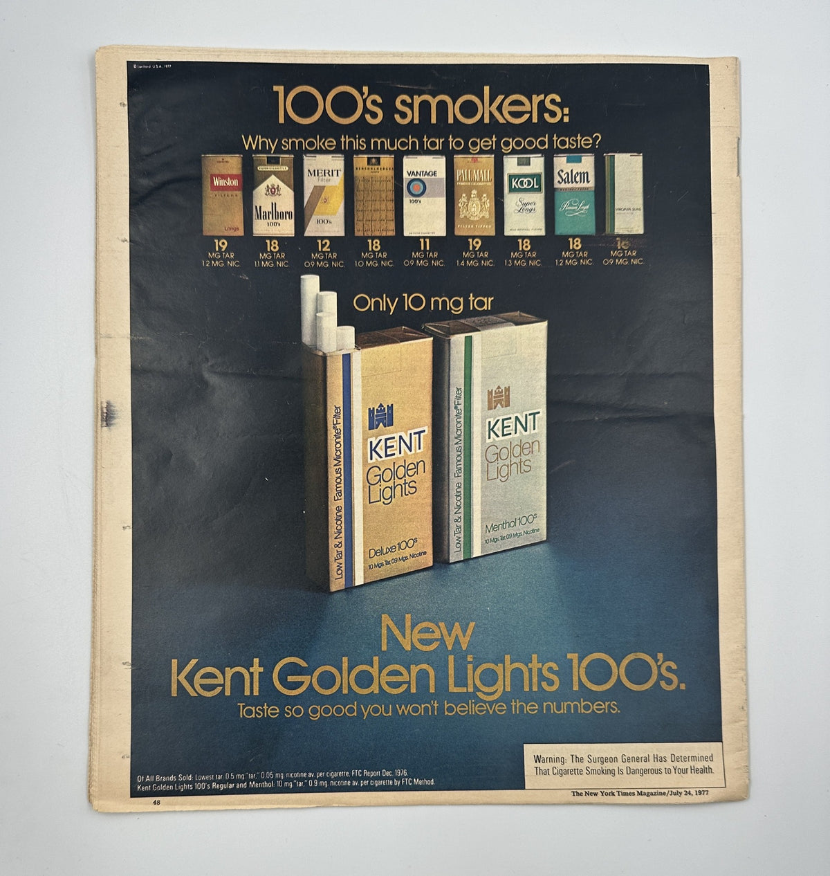 Back cover of The New York Times Magazine July 24, 1977 advertising Kent Golden Lights 100's cigarettes, emphasizing their low tar content and taste.