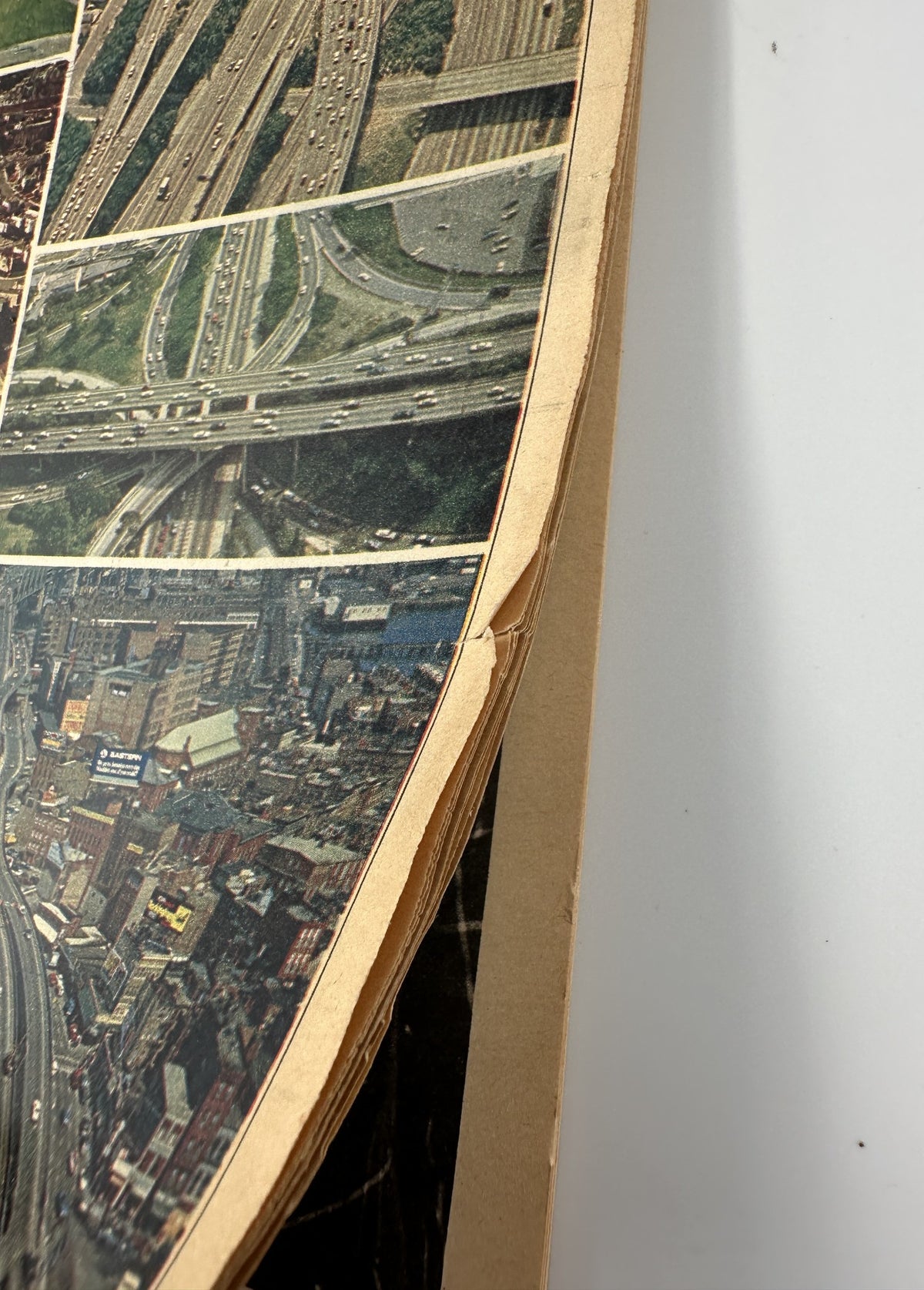 Close-up of the edge of The New York Times Magazine dated October 15, 1972, showing signs of wear with a visible corner crease, reflecting its vintage condition.
