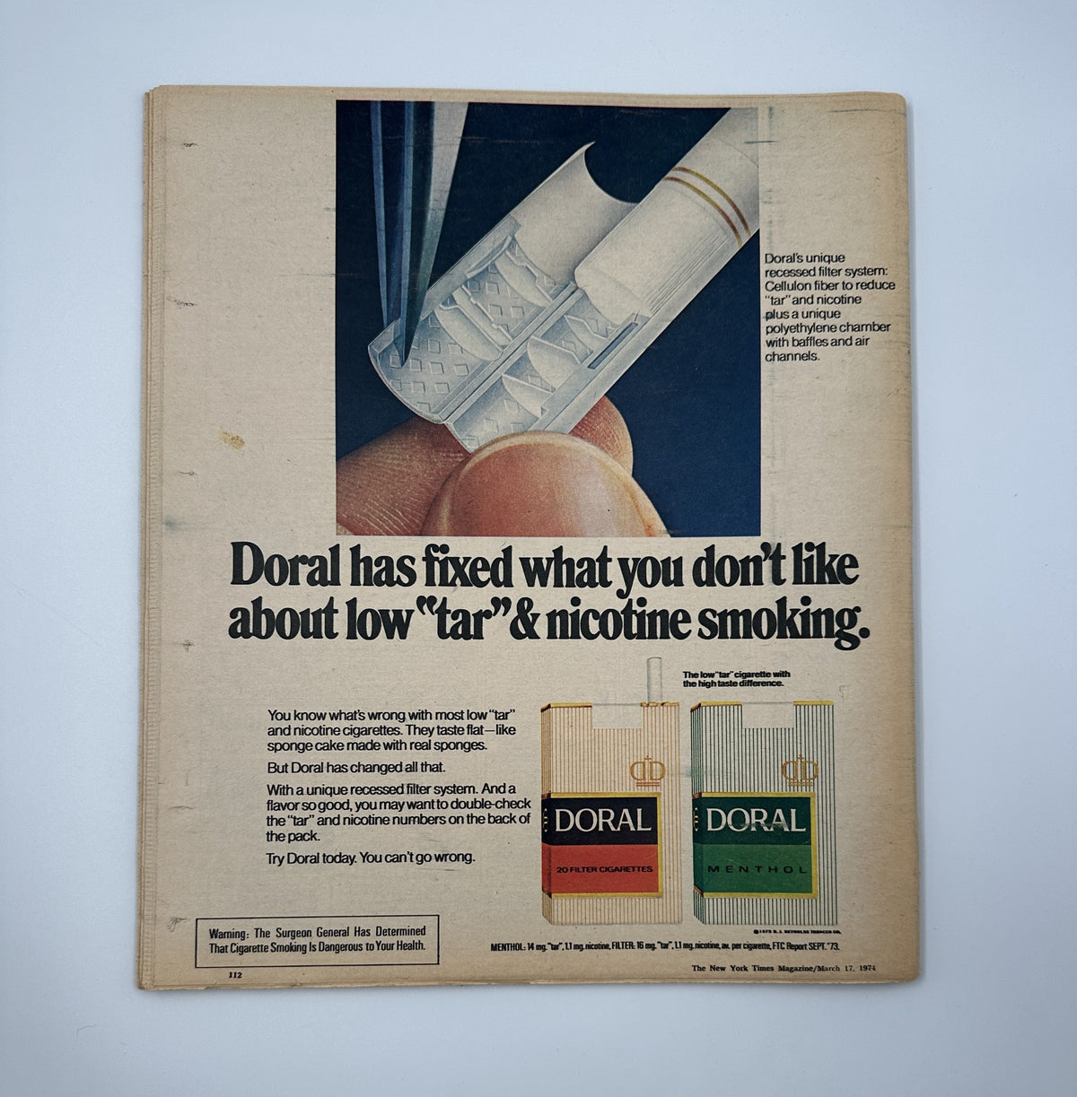 The back cover of The New York Times Magazine March 17, 1974, featuring an advertisement for Doral cigarettes, promoting their low tar and nicotine smoking options.