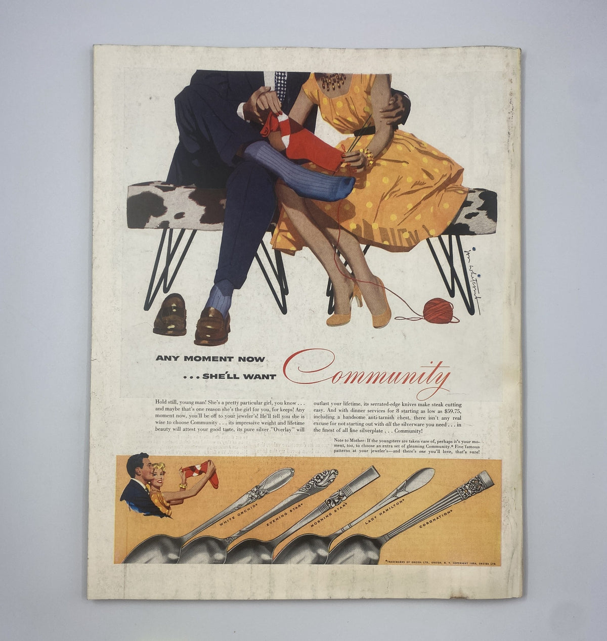 Back cover of Woman’s Home Companion Magazine April 1954, featuring a colorful vintage advertisement promoting Community silverware, with a couple depicted in a warm, inviting scene.