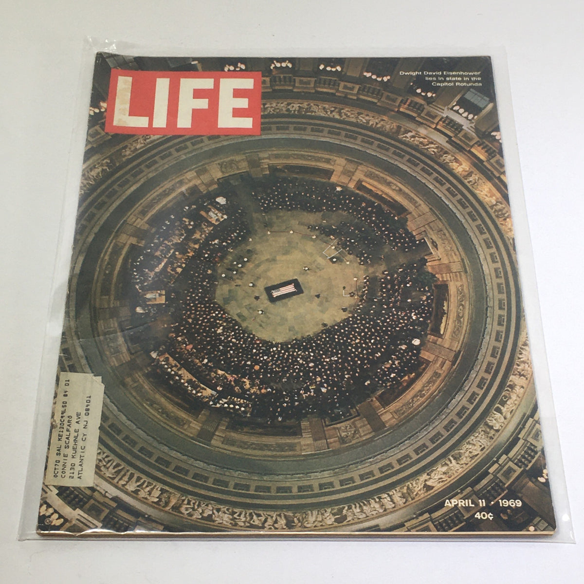 Vintage Life Magazine from April 11, 1969, featuring a poignant image of Dwight David Eisenhower lying in state in the Capitol Rotunda, showcasing the historical significance of the moment.