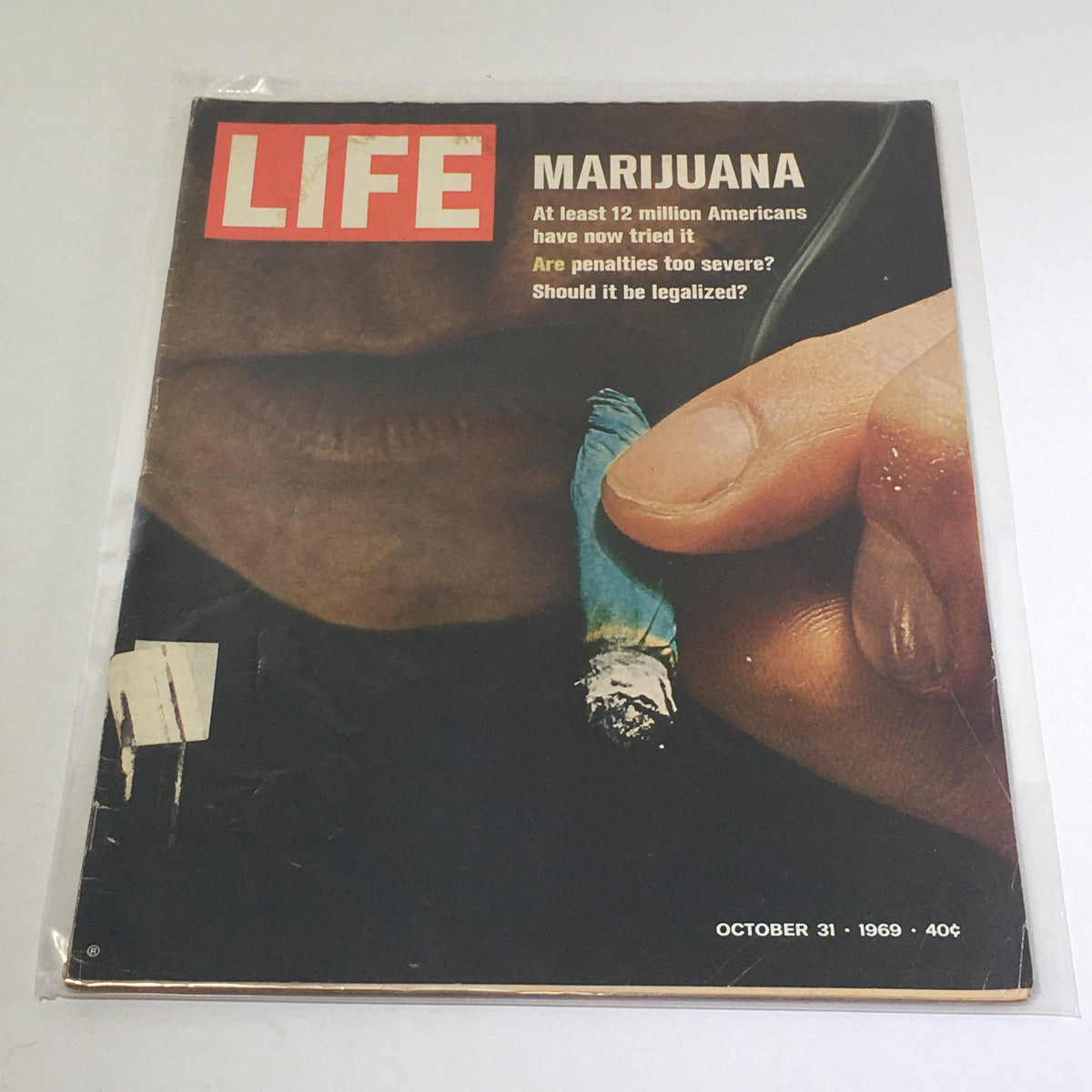 VTG Life Magazine: October 31 1969 cover featuring an article about Marijuana, highlighting that at least 12 million Americans have tried it, with questions on legalization and penalties. The magazine shows a hand holding a marijuana cigarette.