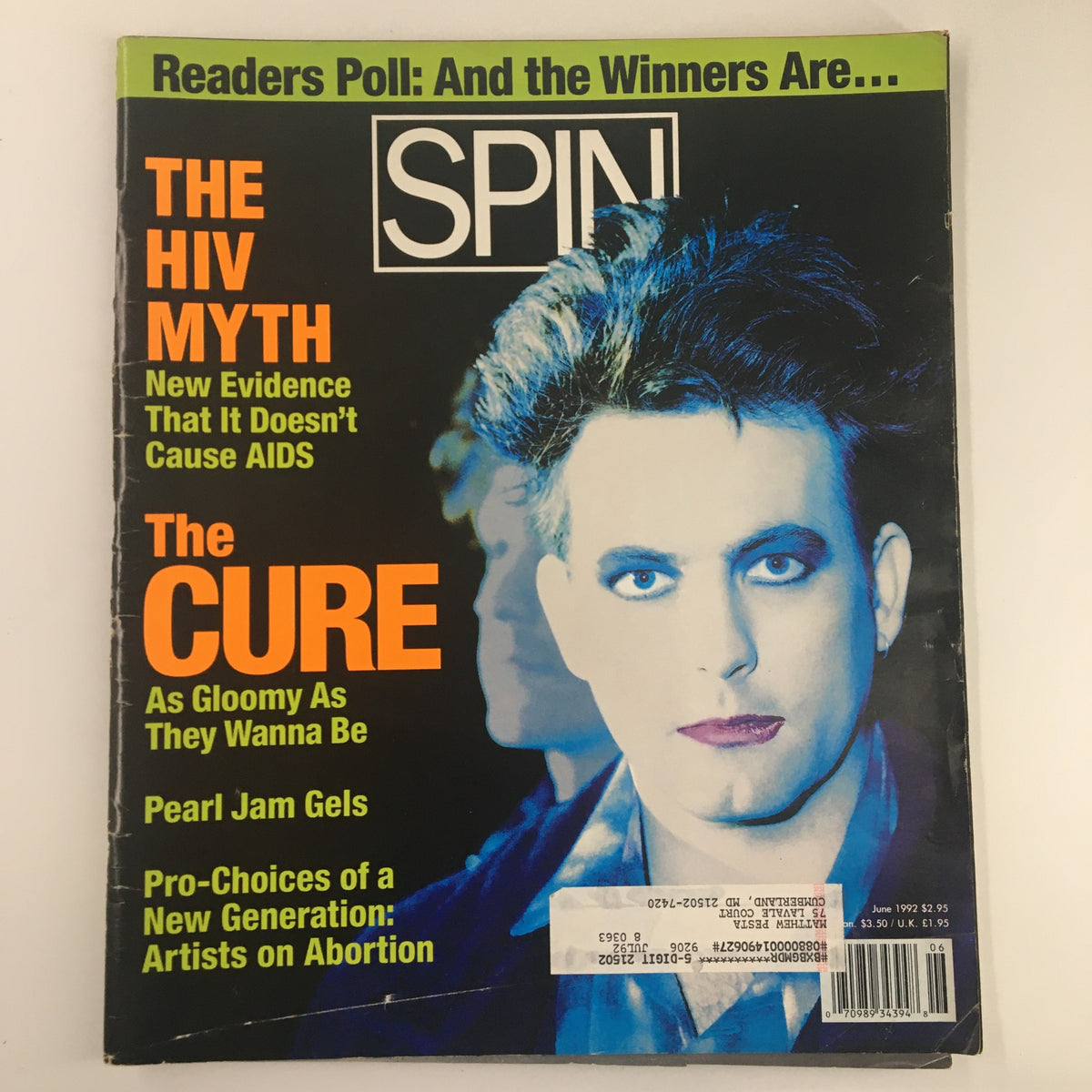 Cover of Spin Magazine June 1992 Vol 8 #3 featuring headlines on 'The HIV Myth', 'The Cure', and insights on Pearl Jam, showcasing a striking image from the era.