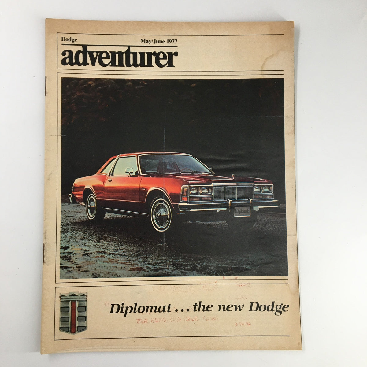 Cover of the VTG Dodge Adventurer Magazine May 1977 featuring the Dodge Diplomat, highlighting its design and automotive appeal.