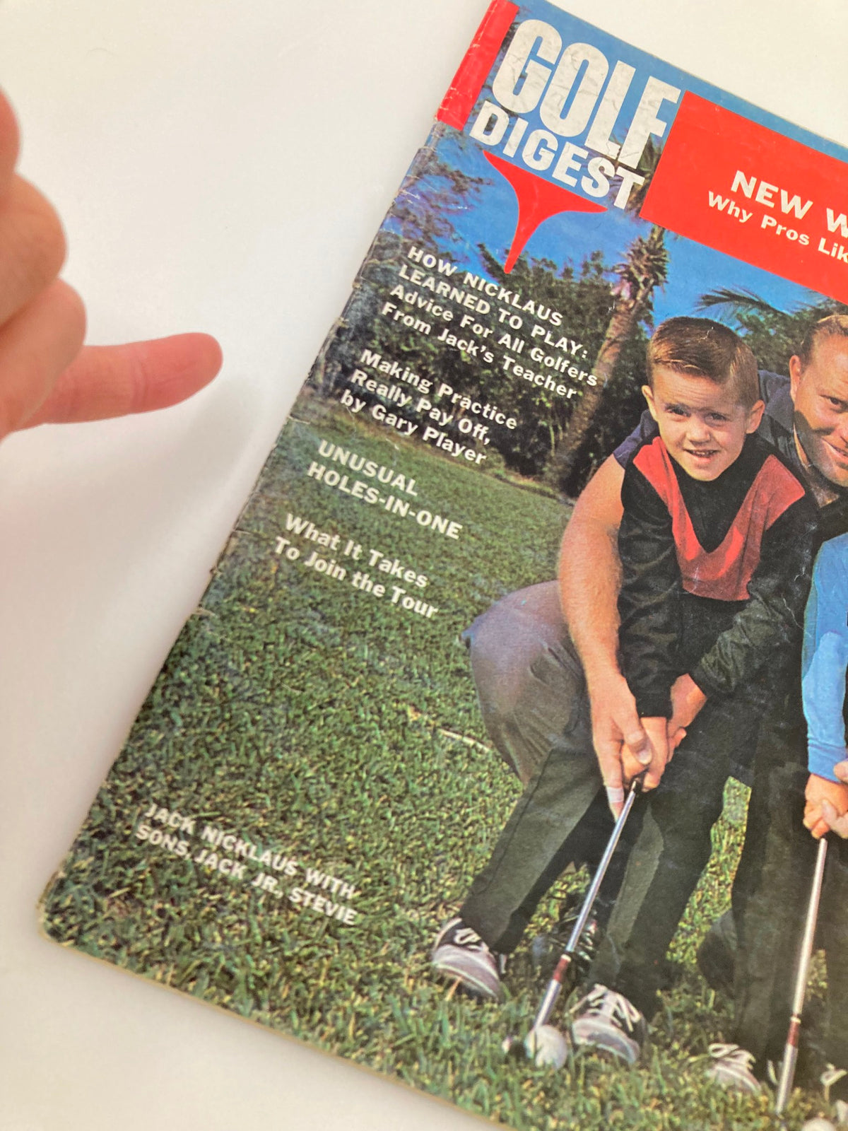 Close-up of the cover of Vintage Golf Digest Magazine March 1966, highlighting Jack Nicklaus and his sons, with excerpts about golfing tips and techniques.