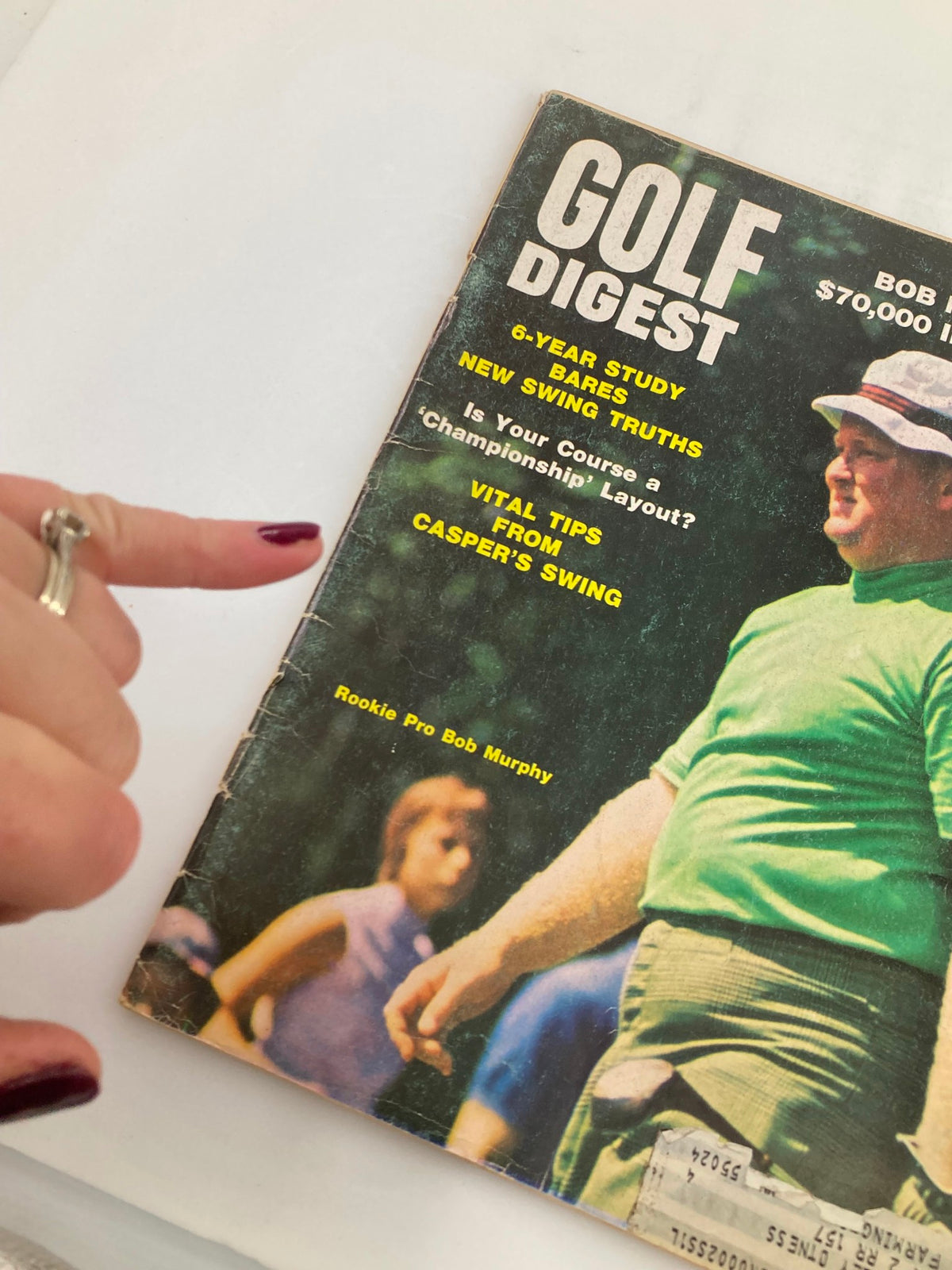 Close-up view of the VTG Golf Digest Magazine November 1968 cover, highlighting Rookie Pro Bob Murphy, with finger pointing at key topics about the magazine's content.
