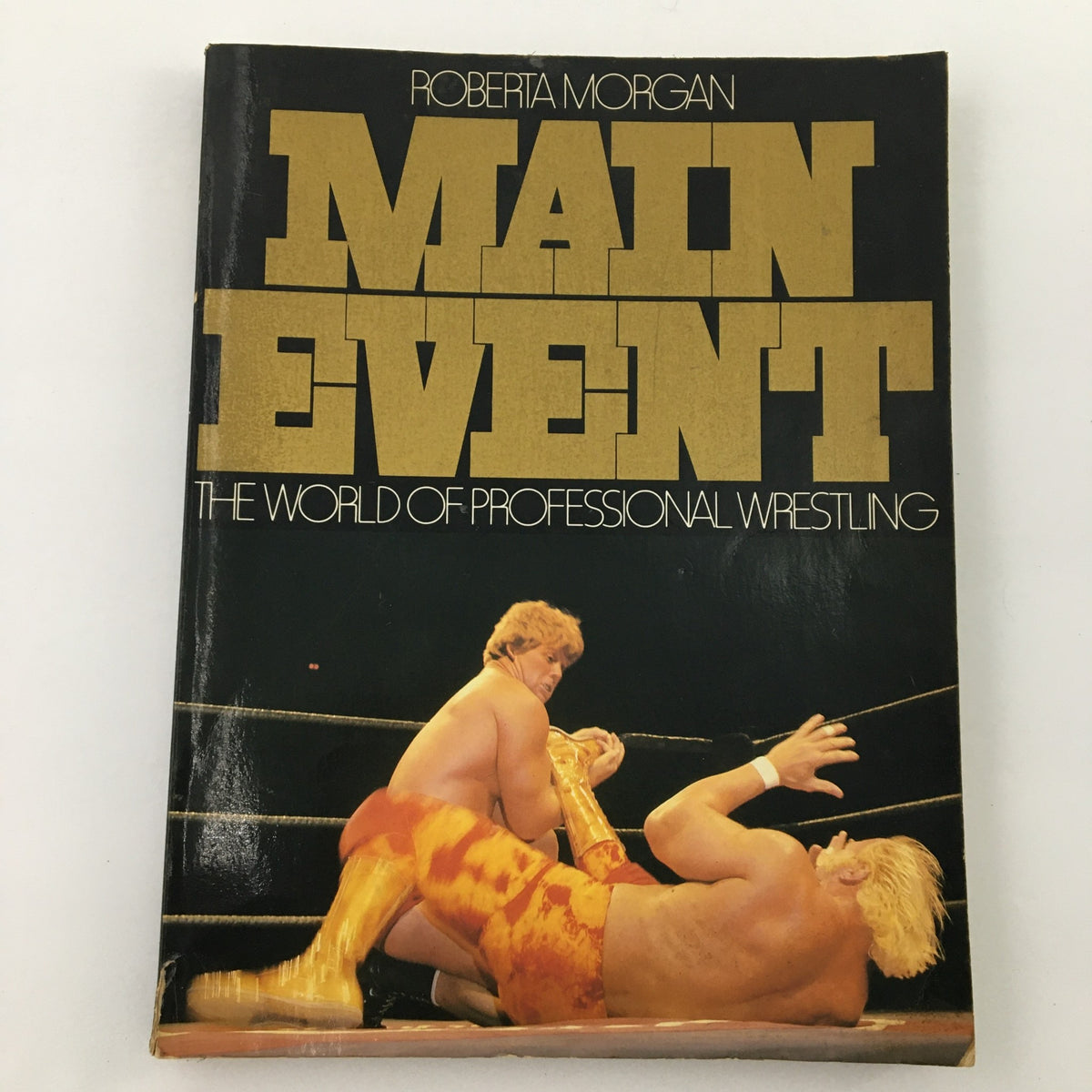 Cover of Roberta Morgan's Main Event: The World of Professional Wrestling, featuring a dramatic wrestling match scene from 1979.