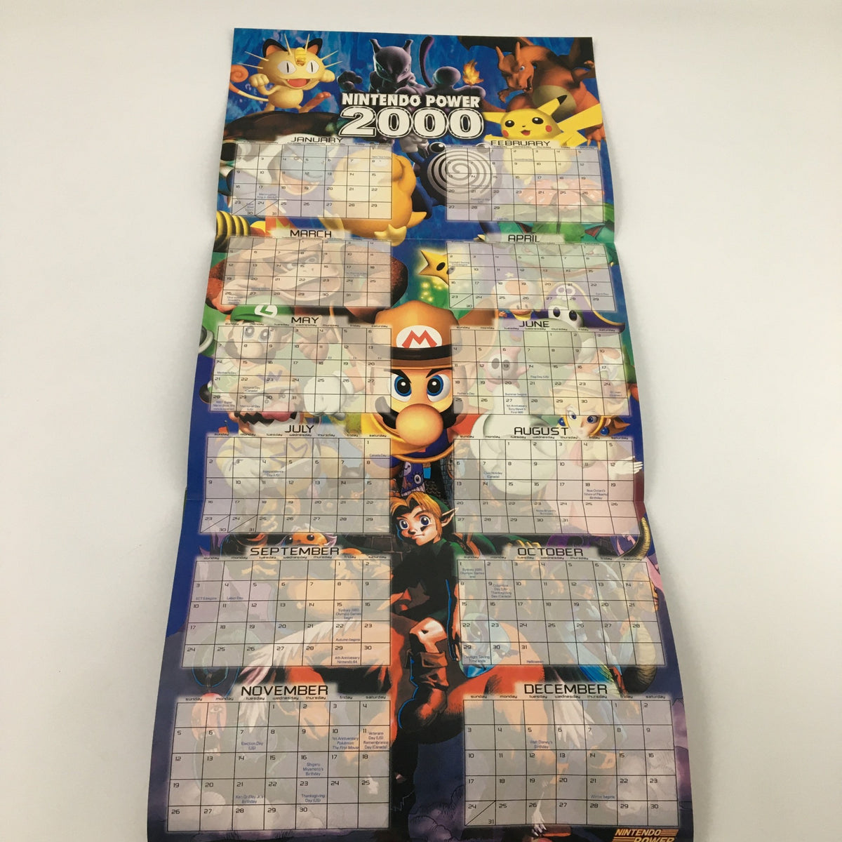 Nintendo Power Magazine January 2000 Vol 128 calendar page for the year 2000 with various Nintendo characters including Mario and Pokemon.