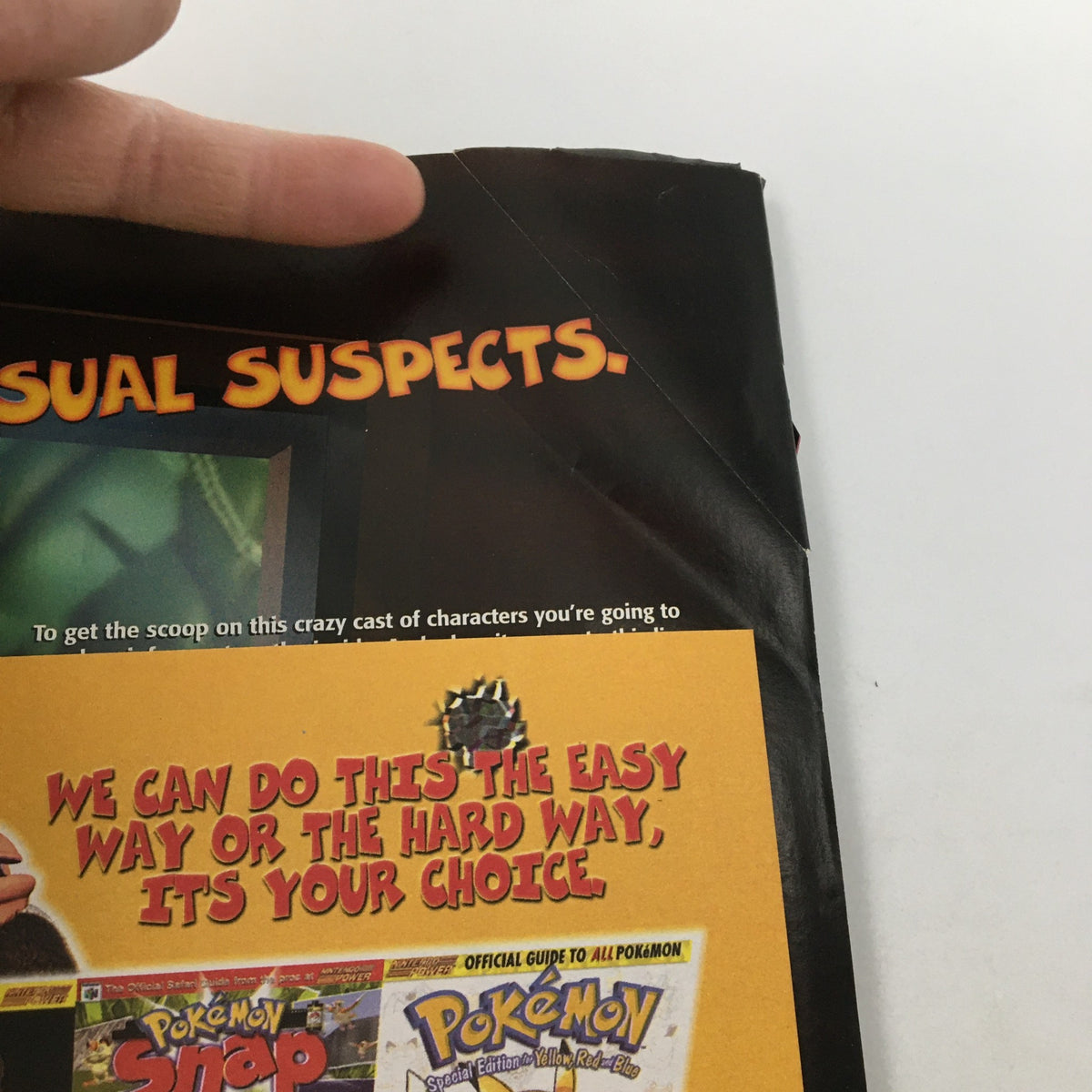 Image from Nintendo Power Magazine November 1999 #126, showing a folded corner page with the text 'Usual Suspects'. This vintage magazine features insights on popular Nintendo games, enhancing its value for collectors.
