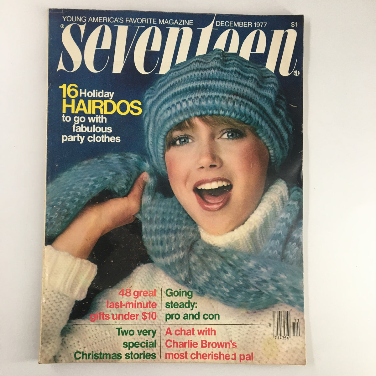 Cover of VTG Seventeen Magazine December 1977, featuring a model in winter attire along with the headline '16 Holiday Hairdos to go with fabulous party clothes', epitomizing 1970s fashion and culture.