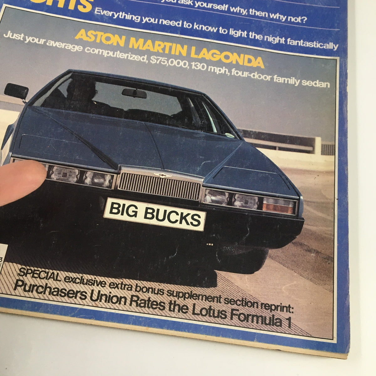 Close-up of the Aston Martin Lagonda on the cover of Car and Driver Magazine March 1979, showcasing its sleek design and prominent 'BIG BUCKS' label.