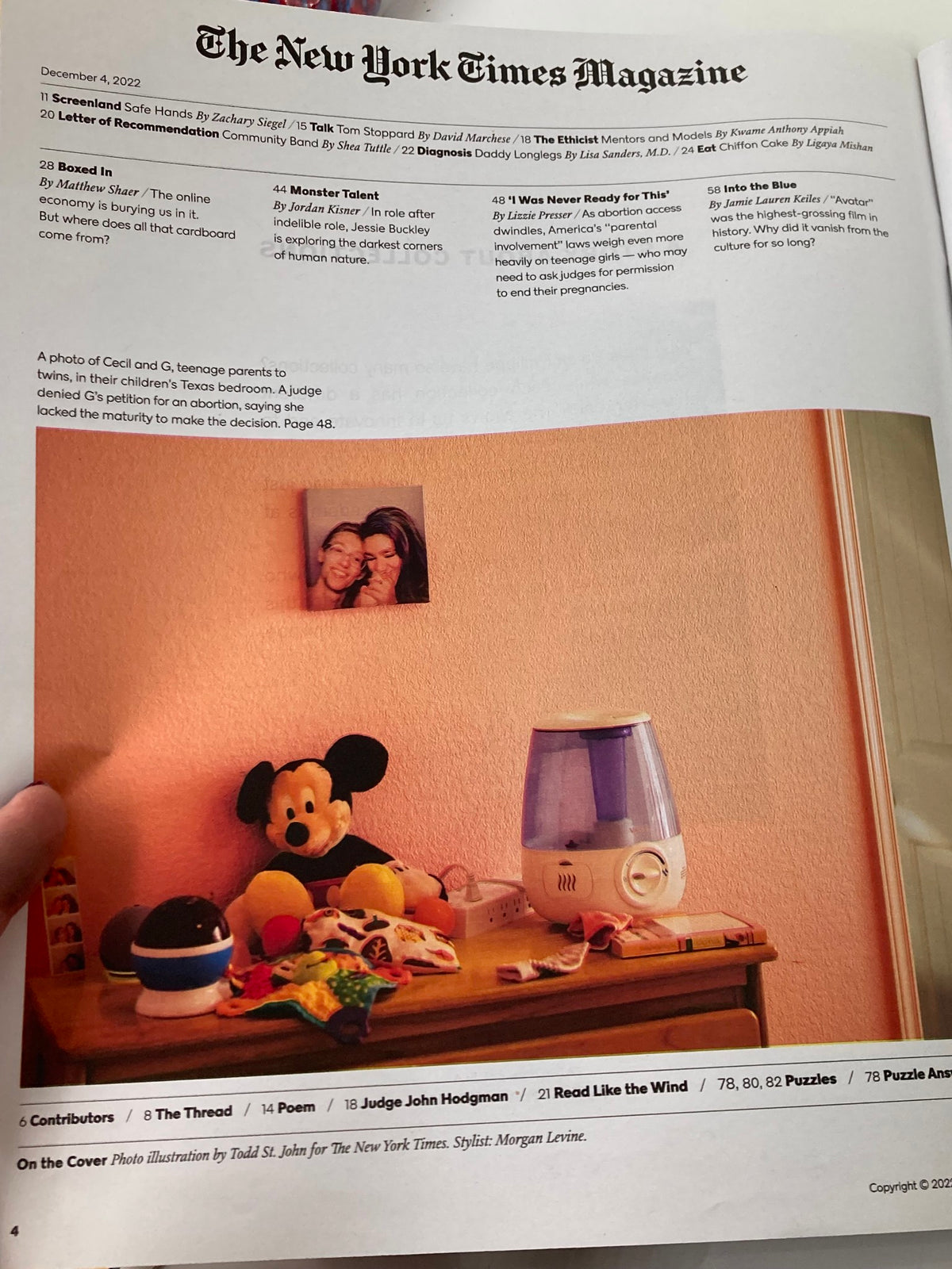 Inside page of The New York Times Magazine December 4 2022 showcasing a photograph of a teen girl's bedroom, featuring personal items like a picture on the wall, a Mickey Mouse toy, and a humidifier.